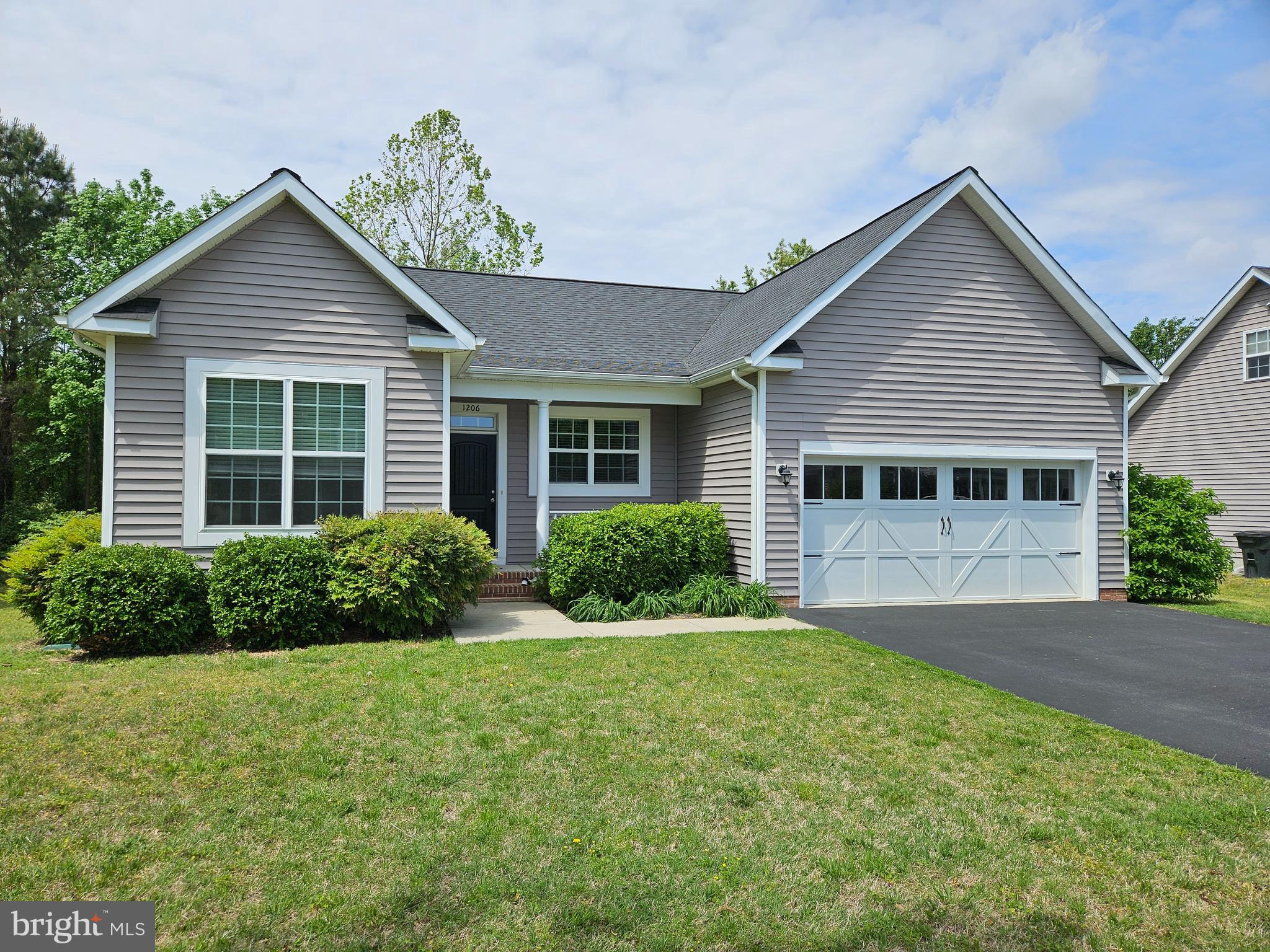 Beautiful open floor plan ranch style home in Trice Meadows . Lot backs to elementary school with trees for privacy. Lovely kitchen with granite countertops, all stainless-steel appliances including propane stove top, dishwasher, garbage disposal, built in microwave and refrigerator. The great room offers large dining area with upgraded lighting and living area with propane fireplace. The primary en suite offers large walk in closet and fabulous bath with custom walk-in shower. Split bedroom layout offers privacy for all. Second full bath with ceramic flooring. Separate laundry room completes the interior. Two car garage with blacktop driveway make this home perfect!