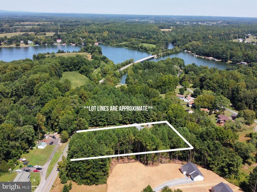 Looking to build on the public-side of Lake Anna? This lot is part of the BlueWater Subdivision and is located outside of the gate on Days Bridge Rd. This community has two common areas with boat slips, which must be requested  through the BlueWater POA. This property is right around the corner from The Cove Restaurant, a delicious seafood restaurant at Lake Anna, and is just minutes from Food Lion and many other restaurants.