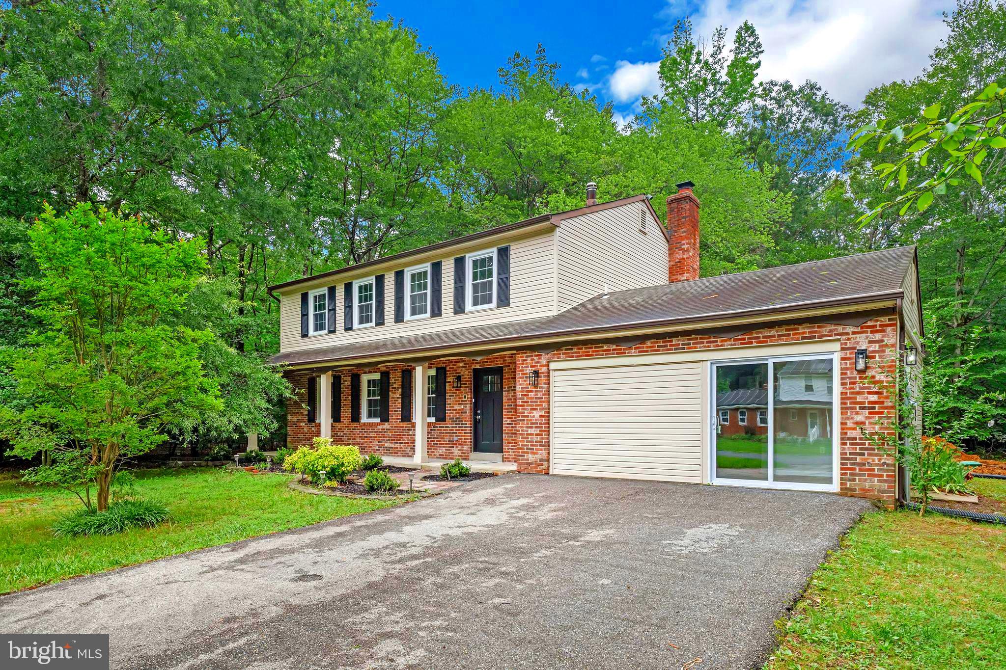 A Dream Property for Hobbyists, Contractors, and Collectors – Featuring a Detached, Oversized 2-Car Garage with Full-Height Storage and Workspace!
Get ready to fall in love with this thoughtfully updated 3-story Colonial, designed for modern living with style, comfort, and functionality in mind! Offering 5 spacious bedrooms, this home greets you with timeless brick-front curb appeal and a peaceful setting that feels like a private retreat.
The detached, oversized 2-car garage is a rare find, complete with full-height space above for storage or a separate work area. Whether you’re a woodworker, hobbyist, contractor, or need extra room for work vehicles and tools, this versatile garage delivers unmatched convenience and flexibility.
Inside, you’ll find a bright, open layout featuring luxury vinyl plank floors and a completely remodeled kitchen with crisp white shaker cabinets, gleaming quartz countertops, and stainless steel appliances. The spacious family room is anchored by a whitewashed brick fireplace, creating a cozy yet modern living space.
Upstairs, 4 well-sized bedrooms are filled with natural light and accompanied by two fully updated bathrooms. The main level also offers a stylish half bath and a flexible bonus room with a private entrance off the garage—perfect for a home office, guest suite, or creative studio.
Step outside to enjoy a spacious deck with endless possibilities for outdoor living. With additional driveway parking, a new septic system for worry-free maintenance, and thoughtful updates throughout, this home combines classic charm, modern comfort, and a garage setup that’s a dream come true for anyone who needs serious space for projects, storage, or work vehicles.