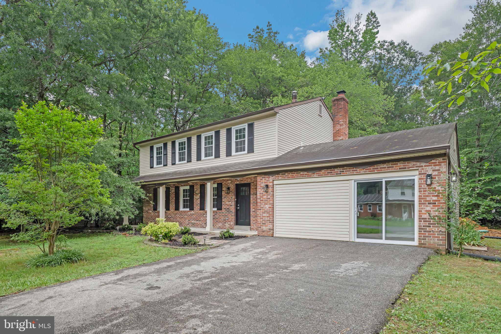 Get ready to fall in love with this thoughtfully updated 3-story Colonial, designed for modern living with style, comfort, and functionality in mind! Offering 5 spacious bedrooms, this home greets you with timeless brick-front curb appeal and a peaceful setting that feels like a private retreat. There’s a large detached garage that provides ample storage, while the new septic system ensures hassle-free maintenance.
Inside, you’ll find a bright, welcoming layout featuring luxury vinyl plank floors and a completely remodeled kitchen with crisp white shaker cabinets, gleaming quartz countertops, and stainless steel appliances to complete the contemporary touch. The open-concept design flows into a generous family room with a whitewashed brick fireplace.
Upstairs, you’ll find 4 bedrooms filled with natural light and 2 fully updated bathrooms with modern finishes. The main level also includes a stylish half bath and a flexible bonus room with a private entrance off the garage — ideal for a home office, guest suite, or creative studio. Step outside to enjoy the spacious deck offering endless possibilities for outdoor dining, play, or simply enjoying the fresh air.
With a 2-car garage plus a driveway that easily fits 2 more vehicles, there’s plenty of parking for everyone. This move-in-ready home boasts 3 finished levels, fresh paint throughout, recessed lighting, and abundant windows that make every room feel airy and inviting. Don’t let this opportunity slip away — come see it for yourself!