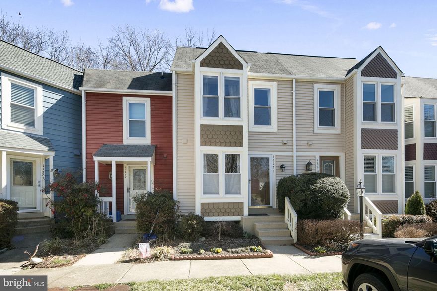 Move in Condition! Sought after Whisperwood - our townhome is nestled in the woods of Reston - a convenient location to Reston Town Center, South Lakes shopping center and 2 miles to Wiehle Metro. Our home has a large deck overlooking a swath of trees that provide both privacy and a great place to entertain family and friends. Our remodeled kitchen has been updated with shaker cabinets with brushed nickel contemporary hardware, loads of cabinets and drawer space, granite counter tops, stainless steel appliances, French door refrigerator with freezer on the bottom, ceramic top stove, Whirlpool dishwasher and a pantry. The main level has oak plank hardwood floor in the entry and breakfast/dining room. The living room offers a wood burning fireplace with a wood mantle and a custom framed decorator accent mirror stretching from the mantle to the ceiling. There are sliding glass doors to the 20 x 15 deck overlooking the woods. On the upper level, we have 2 bedrooms and a full bath. The primary bedroom has his and her closets and large windows with window seats. The full bath has a separate dressing area from the bath tub/shower. The walk out lower level can be used as a game room or a third bedroom with an updated full bath. The laundry is here with a sizeable storage room. The Samsung washer and dryer convey. There is also additional storage under the staircase. The lower level walks out to a patio and the woods. Updates include deck(2021), HVAC(2021), Washer(2018), Powder room vanity(2022), Lower Level full bath vanity(2022), Dryer(2018), Hot water Heater(2018), and refinished hardwood plank floors and new carpet (2018).