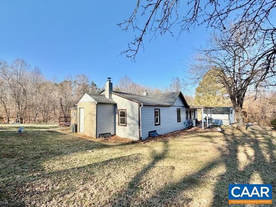 Adorable cottage with so much potential is a strong investment opportunity! Perched on nearly 3.5 acres in Albemarle County just off Proffit Road, this property features 4 bedrooms, 2 full baths, living and family room, laundry room/mud room, along with a spacious kitchen. Several major improvements have been completed within the last two years, including  a new bathroom, new windows, a new roof, a new septic system with drain field repair, updated vinyl siding, and a new deck. HVAC replaced in 2022. Excellent proximity to area amenities at Holly Town Center or Pantops! Property consists of 2 mostly open lots, 2.36 acres and 0.87 acres providing multiple possibilities. Live in home and continue to renovate it, start fresh, or explore the potential to build on the extra lot. This is a project in progress and is ideal for someone ready to complete and maximize its potential. Storage sheds and even an additional building for extra storage - oversized carport has access to electricity and water! Sold as-is, where is.,Formica Counter,Wood Counter