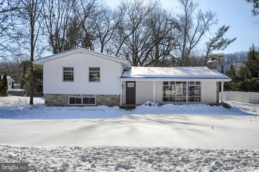 Wow this house is spectacular with so much character! A large covered front porch greets you. Then you enter into a bright lovely living room with a vaulted ceiling and stone fireplace. This flows right into the dining area also with a vaulted ceiling, The kitchen has a breakfast bar and stainless appliances, granite counter tops and recessed lighting. On this level there is access to a deck that is perfect for relaxing and overlooks the serene back yard. Up a short flight of stairs is the primary bedroom with full bath. There is access to another deck! There are also two additional bedrooms and bath on this level. The lower level has the most amazing family room! There is a sliding glass door that takes up the entire wall. There is also a beautiful stone accent wall and a half bath down here. There is also a full basement with  the laundry area. This house has much room to live and entertain inside and out, with your choice of 2 decks, a rear patio and front porch for outdoor enjoyment. Located just minutes from train station and i-76 for easy commuting and K of P mall is close. Do not miss this one!
