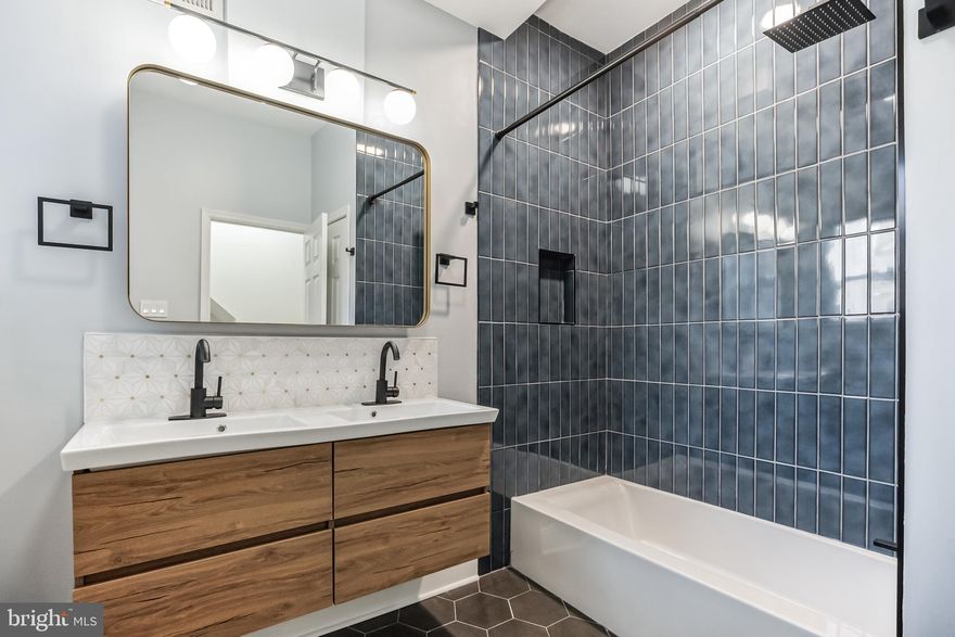 4 large bedrooms (2 primary bedroom suites with ensuite bathrooms), Plus a home office, 3 full bathrooms, and 1 powder room on the first floor make this home a perfect house for working and living with roommates. 2700 Square feet of living space. The first floor features a large living/dining room combination, a kitchen with a breakfast bar, an island, and access to the large back patio. The 2nd floor has two large bedrooms, a gorgeous hall laundry closet, and a bathroom. This floor also includes an office room. The third floor includes two primary bedroom suites each with its own bathroom and one with a balcony and city views. Things to do nearby,  American Sardine Bar (half a block away with huge outdoor dining), OCF Coffee House, many great restaurants on Washington Ave, East Passyunk Ave, and many other great eateries and bars in the area. Take the Ellsworth/Federal subway into Center City.  Walk or ride a bike a few minutes to Rittenhouse Square. The basement is semi-finished but not suitable for living, only storage. Tenant responsible for utilities.