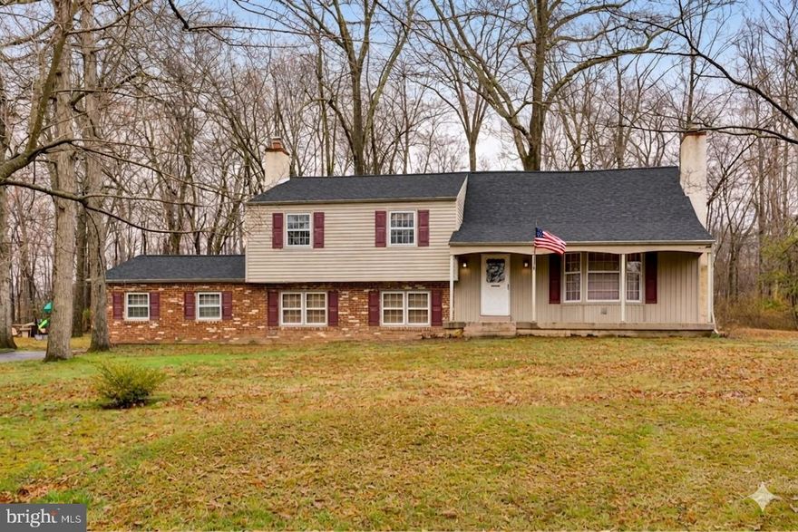 Welcome to the charming neighborhood of Montgomery Woods sitting in the award winning North Penn school district. This lovely, walkable neighborhood boasts large lots, mature trees and accessibility to tons of shops, restaurants, major routes and so much more. This 2500+ square foot home has 4 large bedrooms, 3 full baths, a 2 car garage and charm galore. Having the same owners for the last 46 years, 104 Woodland Dr. has been well loved and cared for. The bones of the house are exceptional, leaving the new owners the availability to use their eye to make the cosmetics exactly as they like. Enter the home off the adorable covered front porch into a large foyer. Here is a coat closet and plenty of space for a bench or getting ready area. This opens up to the kitchen straight ahead, large bright family room to the right and stairs to the 2nd level to the left. The family room has a wood burning fireplace, large bay window looking out to the spacious front yard and plenty of space to do whatever configuration with furniture. This room wraps into the formal dining room and that into the eat in kitchen. The kitchen is a nice size with tons of storage. It's decor will bring you right back to your grandmas cooking. Here you will find a door out to the back patio looking out over the private backyard that backs to woods and has the sweetest shed, great for storage. All the kitchen appliances have been updated. Heading to the lower level you will find an extra large family room (was being used as a makeshift bedroom). This room has so much space you could even make it multi-functional! There is a large closet, plenty of natural light, beautiful wall to wall built-ins with a wood burning fireplace central on the back wall, and new luxury vinyl flooring. This room can also be accessed from the back door foyer that brings you in from the driveway and rear 2 car garage. Finishing out this level tucked away are a full bathroom with a stall shower and a nice size laundry room. Heading upstairs the 2nd level of the home off the main foyer you will find 3 bedrooms, a full hall bathroom and stairs to the upper level bedroom. The primary bedroom has a small walk in closet as well as the sweetest ensuite. The 2nd and 3rd bedroom are ample size with good natural light. The 4th bedroom in the upper level is very spacious and light pours into this room. Its a nice little getaway area, could be a home office or even a great playroom. From here there is access to the storage area in the attic as well. All of the old carpets from the home have been removed exposing the hardwoods that run throughout 80% of the home. They can easily be refinished to refresh their beauty! The yard is perfect for the family to create countless memories and welcome neighborhood friends! Make this home your own room by room. Remember you can change the finishes but you cant change the location!! Location, location, location!! Schedule your tour today! NEW ROOF APRIL 2026!! Welcome home!!