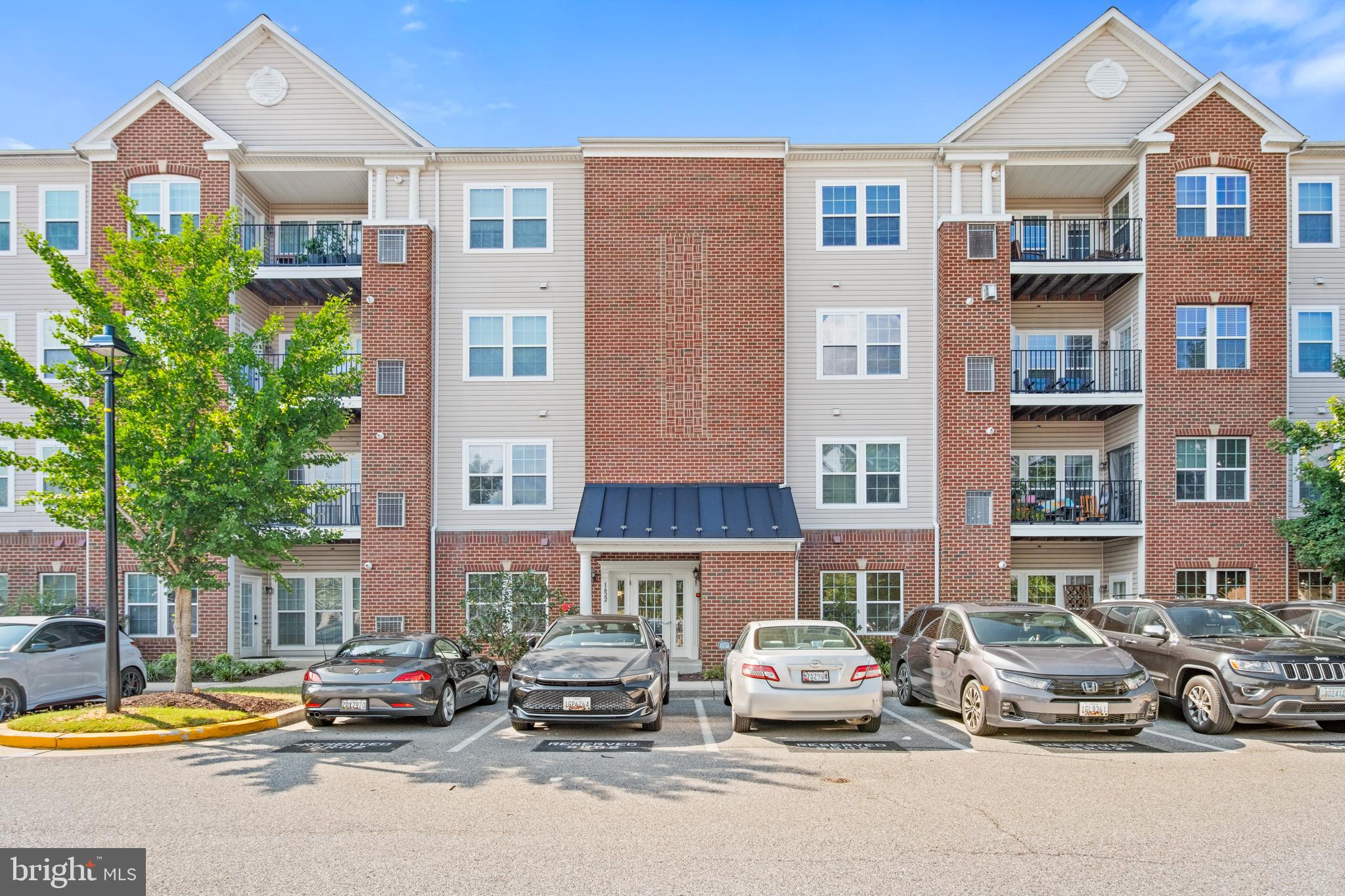Beautifully maintained and thoughtfully designed, this top-floor condo offers the perfect combination of comfort and convenience. Featuring vaulted ceilings, two spacious bedrooms, and two full bathrooms, the layout is ideal for a family, roommates that still want to maintain privacy, or a work-from-home or guest room setup.
Inside, a mix of ceramic tile and plush carpet adds both style and warmth. The open-concept living area flows seamlessly into the kitchen, creating an inviting space for everyday living as well as entertaining guests.
Enjoy the ease of a full-size, in-unit washer and dryer, along with the security and accessibility of a building that offers an elevator, a secured entry with intercom system, and a permitted parking lot with ample visitor spaces.
Located in a highly desirable area, this home is just steps from Arundel Mills Shopping Center, grocery stores, and a wide variety of retail and dining options. With quick access to BWI Airport, Fort Meade, NSA, Route 295, and I-95, commuting and travel are exceptionally convenient.