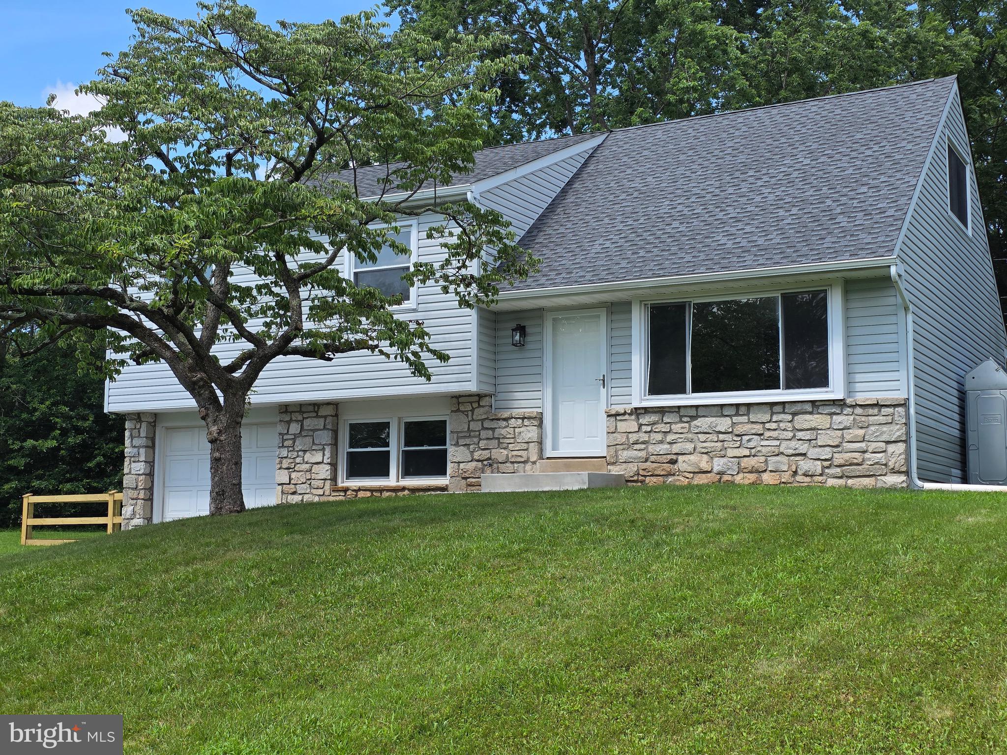 Welcome to this beautiful split level detached home located in the sought after Brittany Farms Neighborhood of New Britain Township, in the great school district of Bucks County! This home has stunning features with premium upgrades all done in 2025. Highlights include: a brand new roof which comes with a 15 years transferrable warranty, modern kitchen with high quality quartz counter tops, featuring all new high efficiency stainless steel kitchen appliances, new flooring throughout the entire house, updated full bathroom and 2 stylish half baths, brand new interior doors, new asphalt driveway, new sidewalk and concrete steps, remote/keypad entry garage door opening, brand new backyard fence, upgraded electrical panel, recess lighting with night/dorm lights throughout the house, new water heater, brand new french drain system in the crawling space-which comes with lifetime warranty, sliding glass double doors leading from the dining area to the patio-great for family gatherings and entertaining! This home blends quality, craftsmanship with thoughtful design-ideal for families or first time home buyers looking for worry-free living!