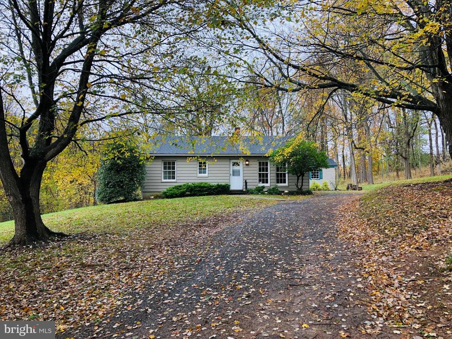 Your cottage get-away, or the site to build your dream home! This one-of-a-kind property with a quaint, two-bedroom cottage sits on nearly 3 acres of lawn and woods. Drive to the end of Homestead Farm Lane and discover the serenity of three neighboring homes spread across 10 acres and surrounded by hundreds of acres of forests and farmland.  Get the best of both worlds – privacy plus the safety and security of having a couple of neighbors to get that emergency jump start. Close, but not too close. Set amongst the bucolic fields of Middleburg, this updated cottage will wow you with its simple charm. From the moment you walk in the front door, you are greeted with hardwood floors sunlit by oversized windows.  Easily flow into the dining area and kitchen where you will find all new stainless steel appliances and new flooring. This modest but welcoming midcentury home has had many updates over the years, the most recent of which have it glowing with fresh paint and shiny new appliances. The cottage is just 4 short miles from downtown Middleburg where you can do your shopping, grab a cup of coffee, or have a special evening of fine dining at the surprisingly large choice of first-class restaurants. Salamander, Red Horse Tavern, Goodstone Inn and Restaurant, King Street Oyster Bar, Thaiverse Middleburg, are just a few of the many respected places to eat and relax. Steak to sushi, pasta to potstickers, Middleburg has it all!