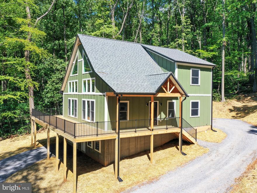 Nestled on Blue Mountain, this stunning home offers tranquility, views, and a perfect place to call home. Boasting large windows, an open floor plan, and main level living, this property stands out above other options on the market. This home is skillfully crafted throughout, a rare find.  Come see it for yourself!