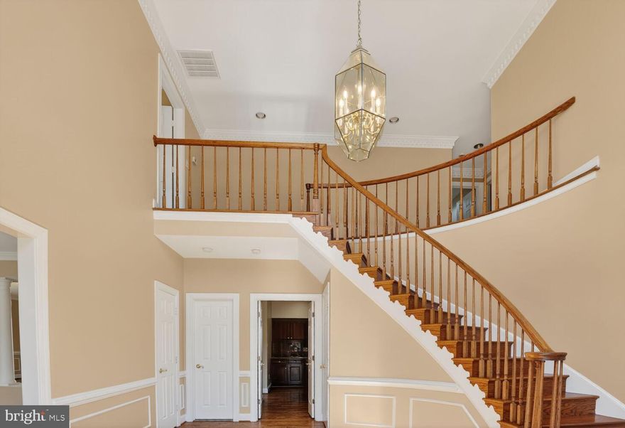 NEW PHOTOS AND TOUR! Stately single family home located conveniently in the alcove of the Quiet Cove cul-de-sac in Annandale.  4,400 SF of finished living space.  Enter in the main level to the curved staircase of the two story foyer.  Solid hardwood throughout the spacious  living room, dining room, family room with wet bar and kitchen with large breakfast nook.  Dining room opens out to rear deck.  Granite countertop kitchen with center island.  Upper level consists of four bedrooms and three full baths.  Primary bedroom with updated bathroom with separate shower and tub. Lower level has large rec room, office and full bath.  Oversized two car garage and driveway that can hold for vehicles. Quiet street with only local traffic of the neighborhood.  Easy access to 495 and a short drive to local convenience stores, restaurants and supermarkets.  Freshly painted with two-tone modern neutral tones!