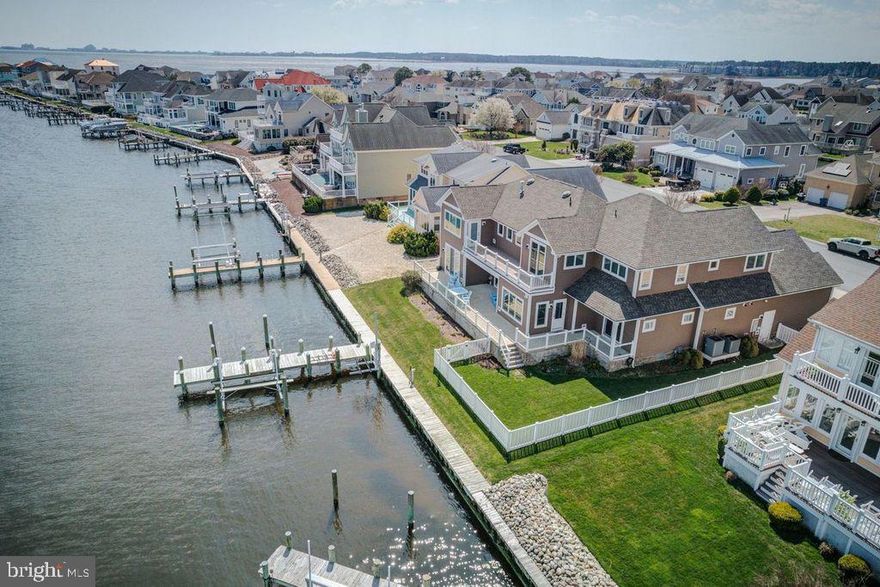 Amazing Waterfront in Ocean Pines!    Enjoy the spectacular bay and Ocean City skyline views from this 6 bedroom, 4.5 bath contemporary waterfront home in the prestigious Tern's Landing neighborhood of Ocean Pines.  Completed in 2018, this outstanding custom- built home built by T & G Custom Home Builders was designed to take advantage of the water views from almost every room.
First floor features a huge open floor plan with a 2-story Great Room, gourmet kitchen, and dining area.  Custom cabinets, Bosch stainless steel appliances, Jenn-Aire gas downdraft cooktop,  quartz countertops, and walk-in pantry complete complete the chef's kitchen.  
Two large ensuites with (beautifully detailed baths) feature walk-out access to the waterfront rear deck.  A "dream" laundry room with built-in cabinetry, powder room, and a light-filled office complete the first floor.
Upstairs features a third expansive ensuite with amazing views and access to the second floor deck.  Three additional bedrooms, a full bath, and a walk-in storage closet,  complete the 2nd floor.  The home offers 5 zone heating and cooling systems, tankless gas hot water heaters, gas fireplace, whole house fire sprinkler system, 2 car garage with ramp access into the home, fenced yard, private pier with remote controlled boat lift and single jet ski lift.
The home is configured for a private elevator.  Enjoy the fireworks from North Side Park in Ocean City and the Ocean City Airshow from the comfort of your deck!  Welcome home to all the special features in the bayfront retreat!