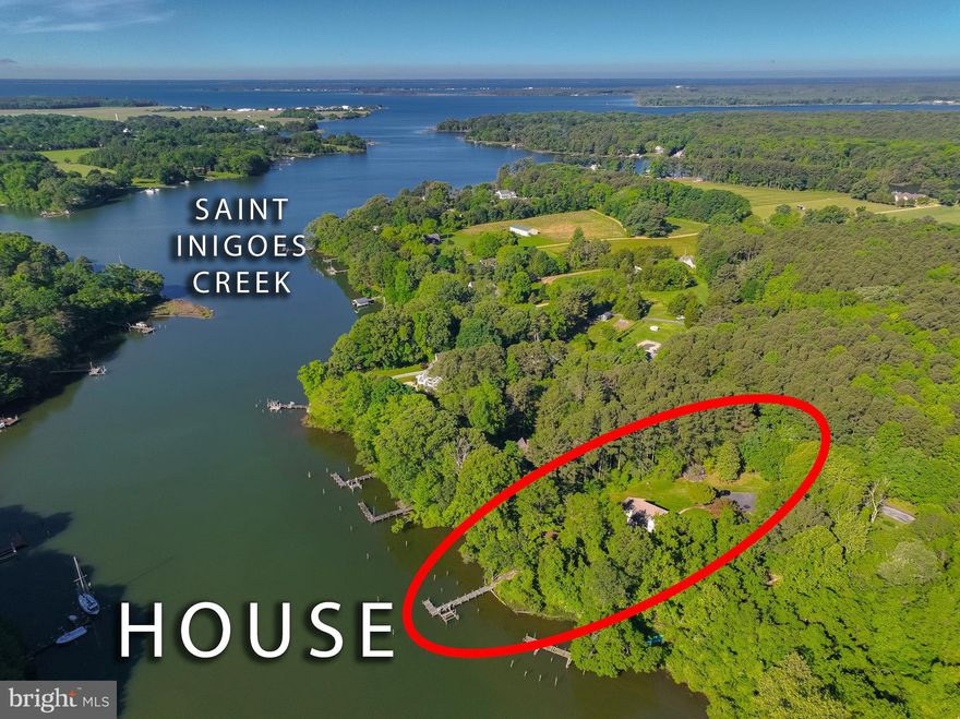 Welcome to your waterfront retreat on 1.23 acres with 167ft +/- of waterfront footage nestled along the serene Saint Inigoes Creek with direct access to the St Mary's River and surrounding waterways.  This home offers the perfect blend of comfort, convenience, and coastal living.  Enjoy crabbing, fishing, kayaking, boating or swimming right from your private pier.  Relax with your coffee or beverage of choice on the upper deck of the home watching the wildlife or sit by a fire on your future decks or patio.  

This spacious home features 3 bedrooms, plus a dedicated office that could easily be converted into a 4th bedroom.  The main level showcases vaulted wood-beamed ceilings, a bright open living area and fireplace.  The primary bedroom features a large bedroom , double sliding doors onto the upper deck along with a unique en-suite that allows for a semi-private , yet shared-space with individual closets and sinks.  The lower level of this expansive home includes a large bedroom, full bathroom and two additional rooms ideal for a home gym, possible guest space, hobby space or second office.  This  level also includes a kitchen/wet bar area,  and a cozy living  room complete with fireplace, perfect for multigenerational living or entertaining guests.   Lastly, who needs a she shed or a man-cave when you can have a detached garage unit with studio space where your imagination can run free.   Come make this your full-time retreat,  potential AirBNB or a second home to get away from the hustle and bustle of the day to day.  

Recent upgrades include New Roof (July 2025),  New interior doors, refrigerator, dishwasher (2024), HVAC-Heat pump with propane back-up for those chilly winters (2023), newer carpet and LVP. 
Home is centrally located to NAS Pax River, Webster Field, St. Mary's College and within 15 mins to shopping and amenities. Contact agent with any further questions.