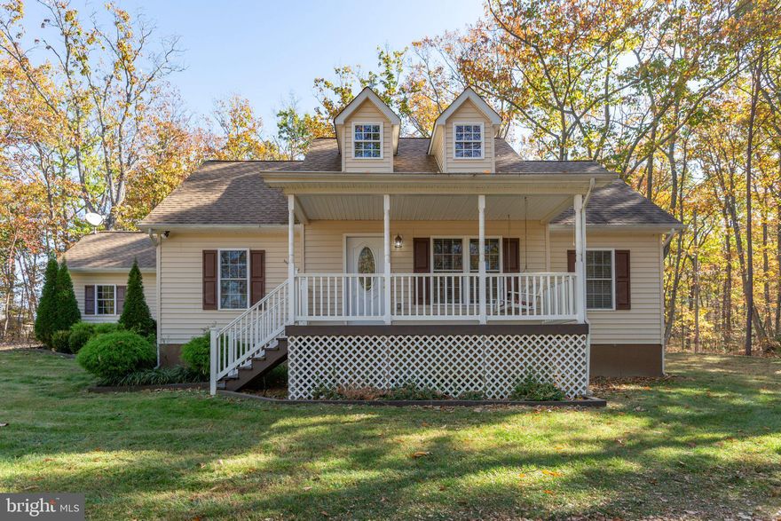 Move In Ready Rambler with Attached Garage,  Almost 2.5 Acres and No HOA! 3 Spacious Bedrooms and 2 Full Baths, Hardwood Floors in Main Living Areas, Carpets in Bedrooms, Large Living Room with Eat-In Kitchen with Spacious Pantry, Primary Bedroom with Two Closets and Bathroom has Separate Shower and Tub! Large Secluded Wooded Lot with Front Porch Swing Included and Long Private Driveway!