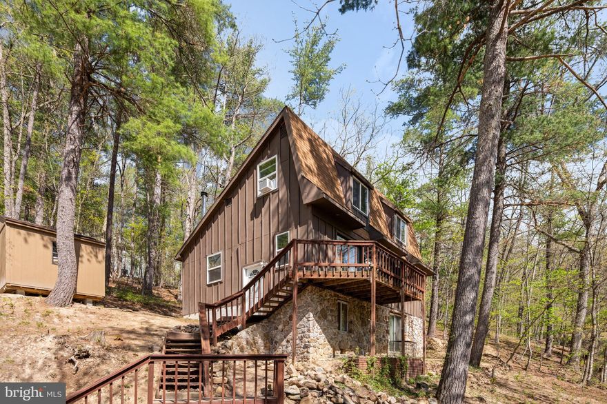 Welcome to Bryce Mountain Resort, where this 3-story mountain home offers 4 bedrooms, 2 full baths, and the cozy charm buyers are looking for in a year-round getaway or full-time retreat. Surrounded by trees and set in the Bryce community, the home features a wood-burning fireplace for relaxing after a day on the mountain and a deck for enjoying the peaceful setting. With three levels of living space, there is room to spread out, host guests, or create the ideal weekend escape. Enjoy convenient access to Bryce Resort’s four-season attractions, along with nearby Lake Laura and the surrounding mountain lifestyle.