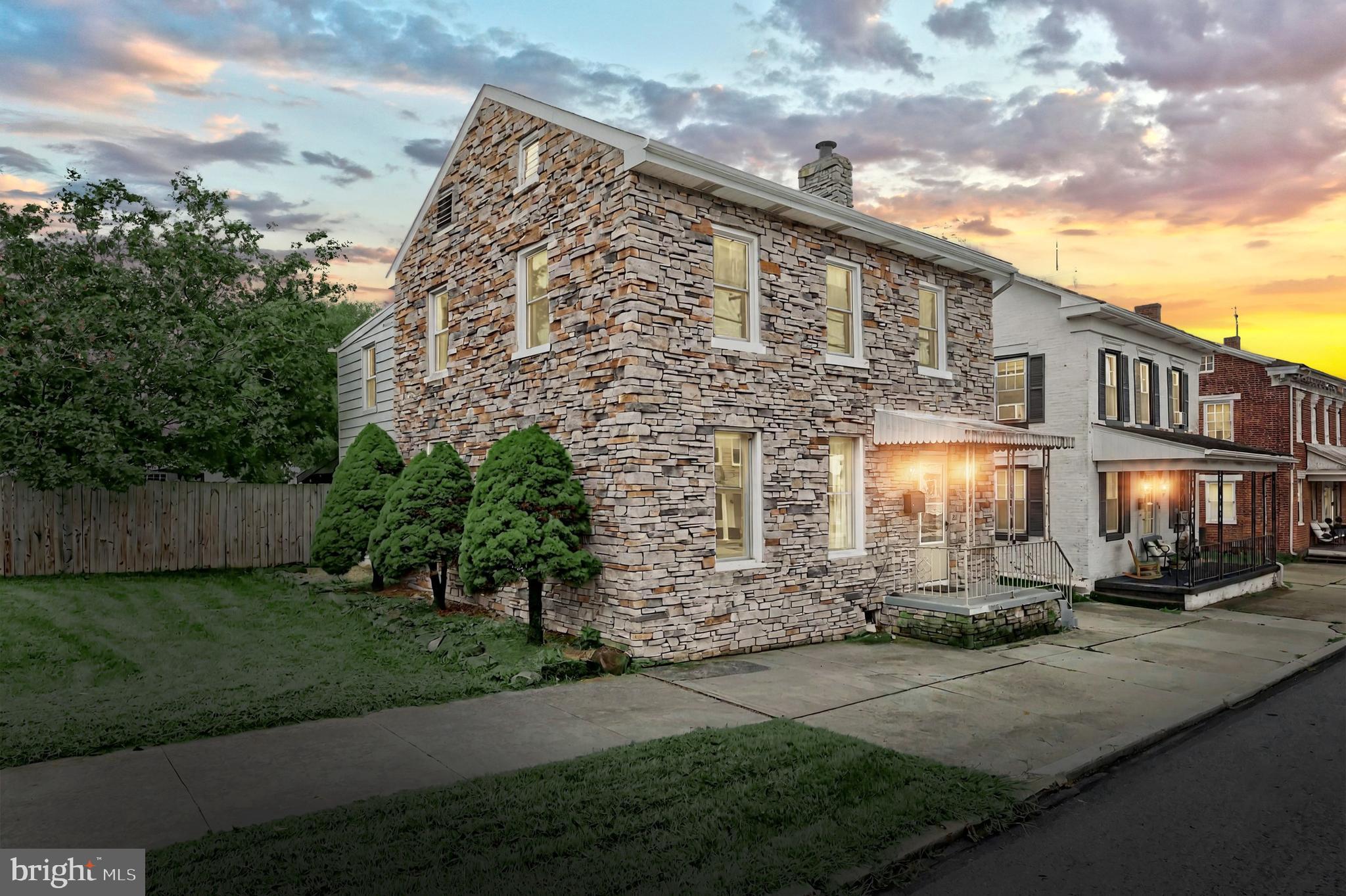 Step into the timeless charm of this 1835 stone colonial, offering 3 bedrooms, 2.5 baths, and over 1,800 sq. ft. of living space. A large, inviting living room, office/bonus room and huge country kitchen with marble countertops, tile backsplash and stainless steel appliances set the stage for gatherings, while the main floor laundry with utility sink adds everyday convenience. Upstairs boasts 3 bedrooms, a bonus room and two full baths, including one with a classic clawfoot tub. Step outside and enjoy the tranquility of the spacious, fenced-in backyard, covered patio, oversized 2-car garage, 2+ car carport, and a more than generous rear parking lot —blending historic character with modern comfort in a truly welcoming home! Sale is contingent upon Seller finding home of choice.