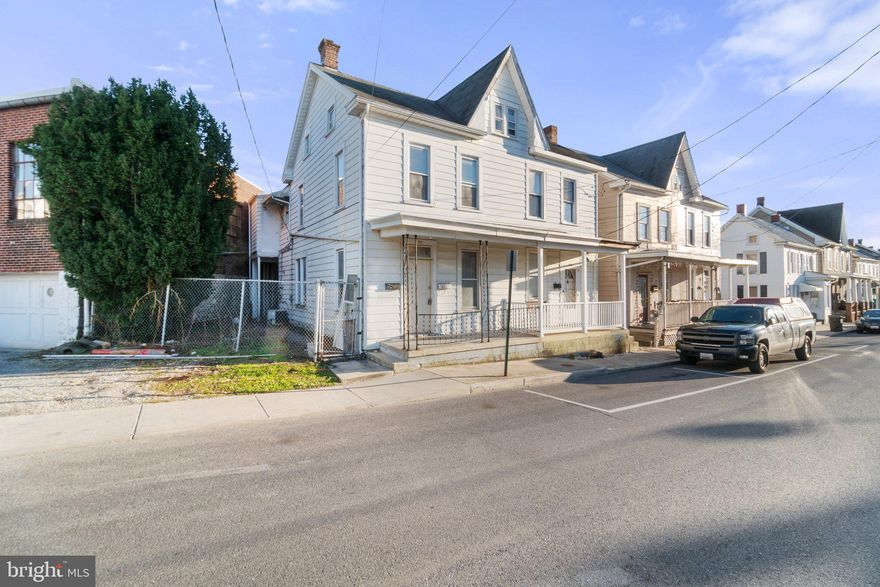 Stylish and fully renovated townhome with two private units, offering the convenience of a duplex but with the modern feel of a townhouse. Ideal for homeowners looking to live in one unit and generate rental income from the other. The first unit, located on the main level, features a spacious bedroom, full bathroom, and separate electric meter. The second unit, on the second level, boasts a full bathroom, bedroom with a bonus finished attic that can serve as an extra bedroom, and a bright and airy sunroom. A fantastic investment opportunity in a prime location, with easy access to restaurants, shopping areas, and major highways easy access to I-81 and I-70, this property is a great investment opportunity. Experience the best of townhome living with this exceptional property.