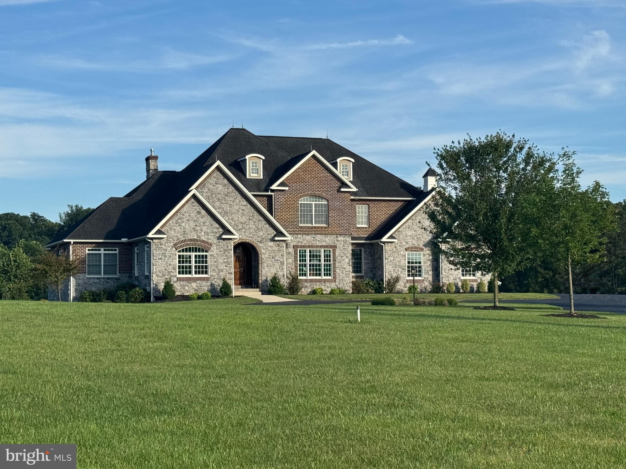Welcome to this exceptional custom-built residence located on over 5 private acres in the highly sought-after Allen Glen neighborhood. Designed with timeless architecture and refined finishes throughout, this home features over 6,000 square feet of living space, including 4 bedrooms, 4.5 bathrooms, and a finished basement.