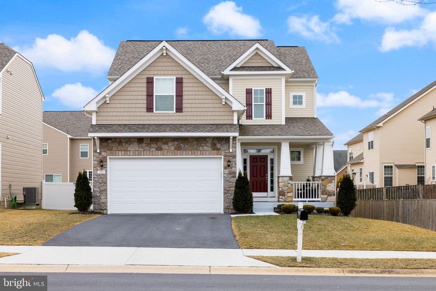 Opportunity to assume FHA loan at below 4%!!   Only 3 years young, why wait for new build?!  Welcome to this stunning craftsman-style home in sought-after Martinsburg Station.  From the moment you arrive, the inviting front porch welcomes you, offering the perfect spot to sip your morning coffee, watch the world go by, or unwind after a long day. Step inside to find a home filled with natural light and warmth, where an open floor plan creates an effortless flow between living spaces.  At the heart of the home, the beautifully designed kitchen boasts a spacious island, gleaming quartz countertops, and stainless steel appliances, making it the perfect space for cooking, gathering, and sharing laughter over meals. Luxury plank floors grace the main level, seamlessly connecting the living, dining, and kitchen areas. Step outside to your partially fenced yard, where a deck awaits—ideal for summer barbecues, quiet mornings with coffee, or evenings under the stars with family and friends. Upstairs, the primary suite is a true retreat, offering a walk-in closet and an en-suite bath designed for relaxation. Three additional bedrooms and a full hall bath provide ample space for loved ones, while the convenient bedroom-level laundry makes everyday life just a little easier. The unfinished basement is a blank canvas waiting for your vision—with a bathroom rough-in, space for a future wet bar, and walkout access to the backyard, the possibilities are endless. Perfectly situated near amenities, shopping, dining, and major commuter routes, this home offers both convenience and community.  Come see it for yourself—and fall in love. Welcome home.