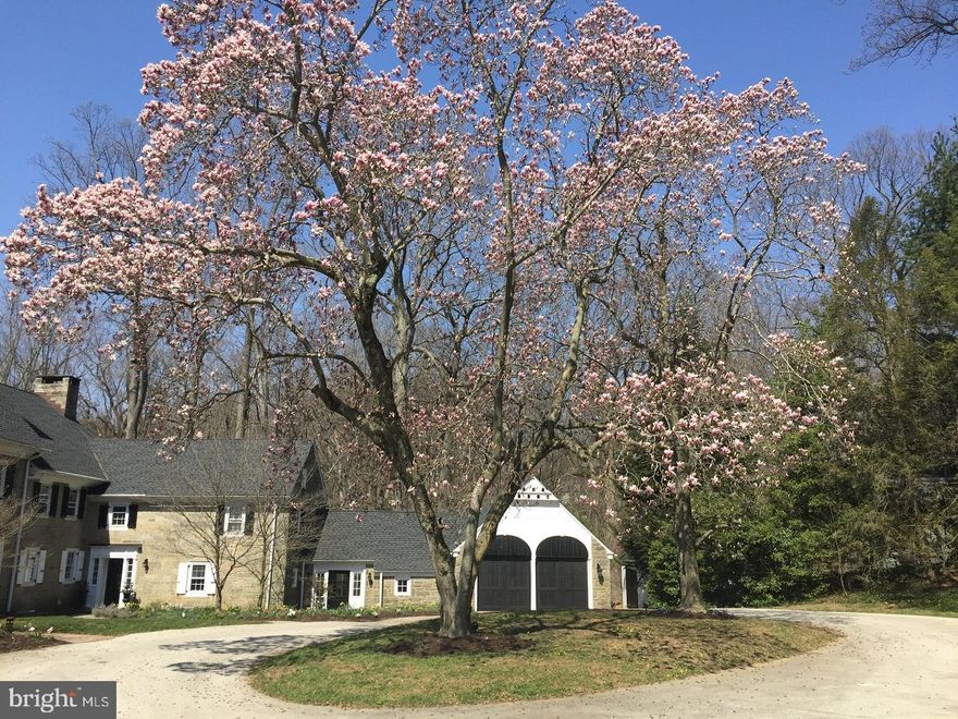 ATTACHE HOME. Designed in 1928 by R.B. Okie, a master of colonial revival, this European-inspired stone mansion represents one of the Main Line's architectural jewels. This unique stone Demi-Mansion on 3.72 shared acres of bucolic manicured grounds, is cleverly situated to offer unparalleled privacy to each residence. This 3-story, 4-5 Bedrooms, 4.5 baths home reminiscent of an English country estate will appeal to the most discerning and sophisticated buyer not only for its charm and world timeless elegance, for an abundance of architectural details including 6 fireplaces, wide board with random-width wood floors, hand-rolled tinted window panes with original hand-made locks, hand-carved mantles, and small bird houses atop the roof but also for the exquisite quality and craftsmanship 2013-2017 extensive renovation with flawless execution done to suit today's lifestyle. Hallmarks include imported Lacanche French ranger stove, Miele dishwashers, hand-crafted German Silver Sink, 2" Vermont Danby marble, soapstone backsplash, soapstone and teak wood counters, Duravit and Toto fixtures, Dornbracht faucets, Victoria+Albert faucets and clawfoot tub, Carrara marble floors and radiant heat. It MUST be seen to be fully appreciated.