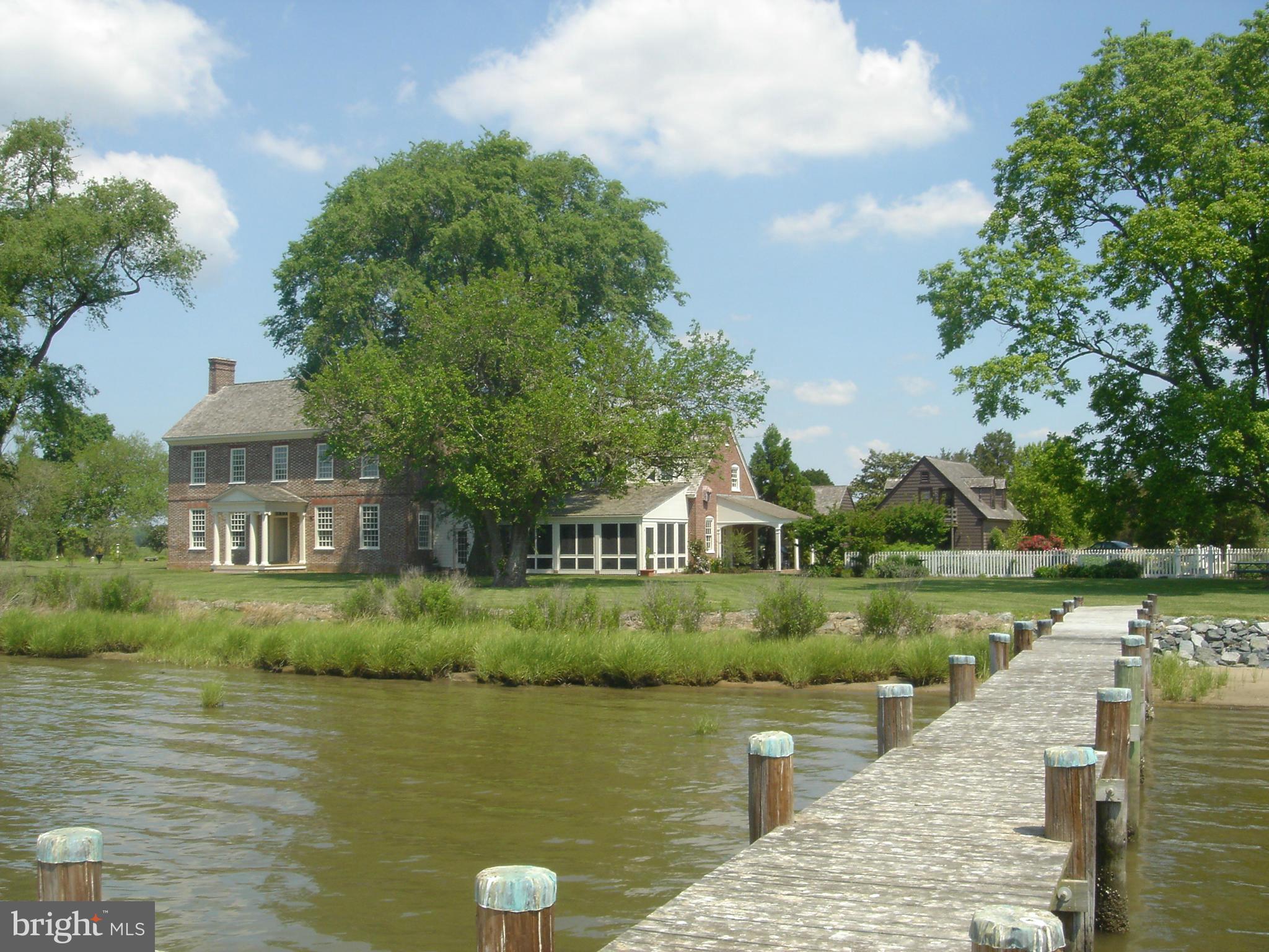 Spectacular historic waterfront farm with 1740's brick manor house, which was restored to award wining level in 2002. The stately home is enhanced by a guest house, guest apartment over the detached garage and gardens, all in a beautiful setting on the Manokin River with almost a mile of shoreline, broad water views and very private.