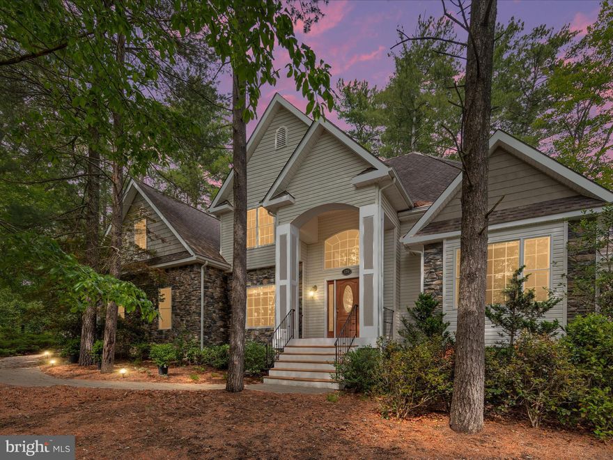 Custom-Built, One-Owner Home in Lake Holiday

Vacation where you live in this 3,000+ sq. ft. contemporary beauty with stunning lake views. Perfectly positioned on a spacious lot, this thoughtfully designed home offers a fantastic blend of comfort, style, and functionality.

The main level features a primary suite with direct deck access, a den/home office, and a beautifully appointed kitchen with maple cabinetry and granite countertops. At the heart of the home is the soaring two-story family room, showcasing a floor-to-ceiling stone fireplace and dramatic Palladian windows that fill the space with light.

Upstairs, an open overlook into the family room creates a bright, airy feel, and three additional bedrooms plus a full bath offer plenty of space for family and guests.

The walkout basement—nearly 1,400 sq. ft.—is ready for your vision, with a rough-in for a full bath and wide-open space perfect for finishing. A side-load two-car garage completes the package.

Enjoy all that Lake Holiday living offers—boating, swimming, beaches, fishing, and more. This is more than a home- it’s a lifestyle.

**items to note - Furnace is approx. 3 years old (main floor). Upper level heat pump original. Roof is original.  Water heater is tankless - approx 2 years old.