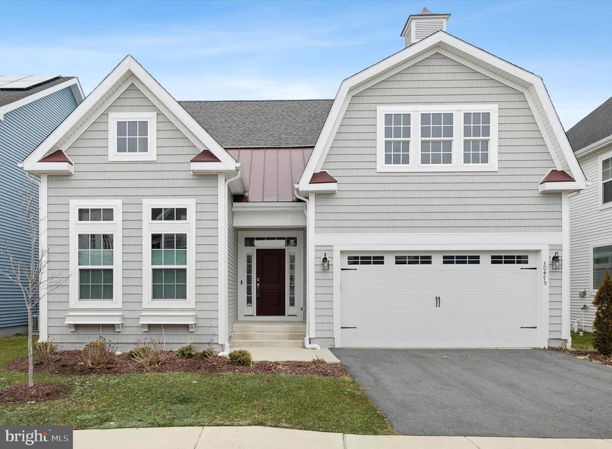 Welcome to refined coastal living in the highly desirable community of Marlin's Chase, a picturesque enclave of charming Craftsman-style homes built by the renowned Shell Brothers. Nestled on Delaware’s Eastern Shore, this exceptional three-bedroom, three-bath residence embodies elevated design, timeless architecture, and the relaxed sophistication of life near the water. From the moment you arrive, the home’s inviting curb appeal and thoughtful detailing set the tone for what awaits inside. Step through the welcoming entryway, where your eye is immediately drawn to elegant French doors opening into a private study, ideal as a home office, library, or quiet retreat. Transom and celestial windows flood the interior with natural light, enhancing the airy coastal aesthetic and highlighting the gorgeous luxury vinyl plank flooring that flows seamlessly throughout the main living areas. Recessed lighting adds a warm, refined glow at every turn. A spacious two-car garage adds everyday convenience and ample storage, perfectly complementing the home’s thoughtful design. At the heart of the home, a stunning great room offers the perfect setting for gathering and entertaining. Anchored by a beautiful, oversized fireplace and framed by views of the screened porch and patio beyond, this expansive space blends comfort with sophistication. The adjoining dining area creates effortless flow for both intimate dinners and lively celebrations. The show-stopping gourmet kitchen is designed to impress even the most discerning buyer. Quartz countertops gleam beneath under-cabinet lighting, complementing warm wood cabinetry complete with display cabinets and convenient pull-out drawers. A massive center island with a breakfast bar invites casual dining and conversation, while the extra-large six-burner gas range, topped with a custom hood crafted from matching cabinetry, makes a striking focal point and a true chef’s delight. Privately tucked away, the owner’s suite overlooks the serene neighborhood pond, offering peaceful views and a luxurious escape at day’s end. Dual walk-in closets provide generous storage, while the spa-inspired en-suite bath features dual vanities, a soaking tub, and a spacious walk-in shower. The second bedroom enjoys the comfort and privacy of its own en-suite bath, and the third bedroom is conveniently served by a beautifully appointed full hall bath, ideal for guests.
Outdoor living is equally exceptional. A large screened porch opens to a wraparound patio overlooking the fenced rear yard and tranquil pond, creating the perfect backdrop for morning coffee, evening sunsets, or weekend gatherings with friends and family. Life in Marlin’s Chase is designed to embrace the very best of coastal living. Residents enjoy a vibrant community atmosphere with amenities that include a sparkling outdoor pool, community garden, playground, pickleball courts, and a scenic pond adorned with fountains, all surrounded by beautifully crafted homes that reflect timeless Craftsman charm. Beyond the neighborhood, the allure of the Delaware beaches awaits. Just a short drive brings you to Bethany Beach Town Center, where boutique shopping, exceptional dining, and the beloved shoreline create the quintessential coastal lifestyle. This remarkable Shell Brothers home offers not simply a residence, but a refined retreat in one of the Eastern Shore’s most enchanting communities.