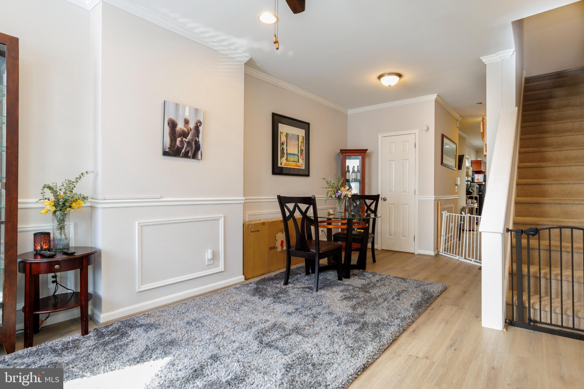This charming interior row townhouse, built in 1925, offers a delightful blend of classic architecture and modern convenience in the heart of Philadelphia (South). The exterior features a warm stucco façade, complemented by inviting sidewalks and street lights that enhance the neighborhood's charm. Enjoy the city views from your rooftop patio, perfect for relaxing evenings or entertaining friends. Step inside to discover a fully finished basement, providing ample space for storage or a cozy retreat. The home is equipped with essential appliances, including a dishwasher, making daily living a breeze. The flooring throughout is a harmonious mix of fully carpeted areas, tile, and wood, creating a comfortable and stylish atmosphere. Located in an urban setting, this property is just a short distance from public transportation options, including a bus stop less than a mile away and a metro station within three miles, ensuring easy access to the wider city. The vibrant community is enriched by nearby parks, offering green spaces for leisure and recreation, as well as local schools that contribute to a strong sense of community. With on-street parking available, this home is not only a comfortable retreat but also a gateway to the lively culture and amenities of Philadelphia. Embrace the urban lifestyle while enjoying the warmth and comfort of this inviting residence.