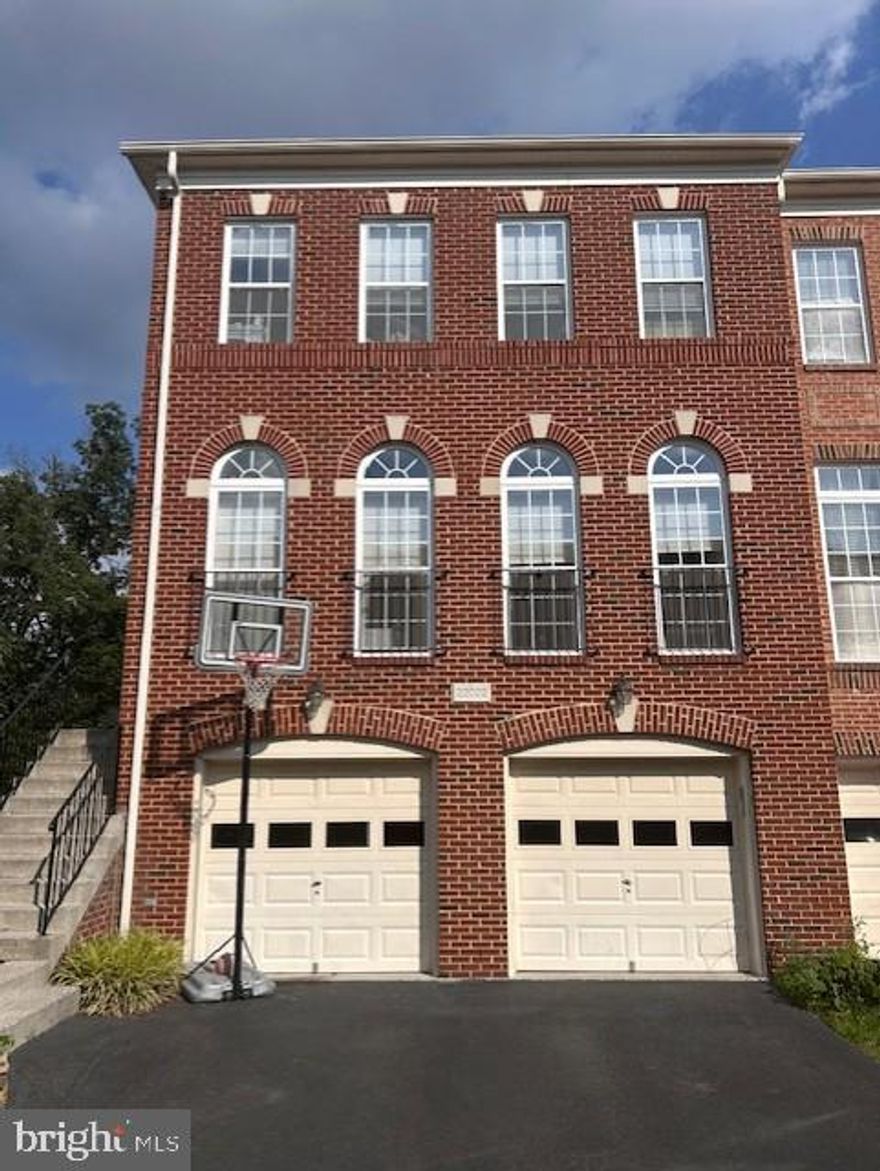 Now available to rent. Beautiful 3 story end-unit townhouse with 2 car garage in highly sought after Broadlands and in fantastic school zone. This house backs a wooded area. Over 2900 square feet with 4 bedrooms 3 and 1/2 bath and 3 bump outs for additional space. Kitchen has an open floor plan. Natural light on all levels. Newly installed hardwood floors. Main level features a large living room, dining room, kitchen with new appliances. Gas range; wall oven; built-in microwave; refrigerator with ice-maker; sunroom off kitchen leads to large deck, perfect for entertaining; Large Master Bedroom has a bonus sitting room; 2 additional large bedrooms on upper level Washer/Dryer on upper level; Gas Fireplace on Main and lower levels; Fourth bedroom on lower level with full bathroom; EV charger installed in garage; additional refrigerator and tool storage in garage; pets accepted on case by case basis. Close to shops, restaurants, schools, free amenities to include community pool; gym; tennis courts; trails, Loudoun Station and more.