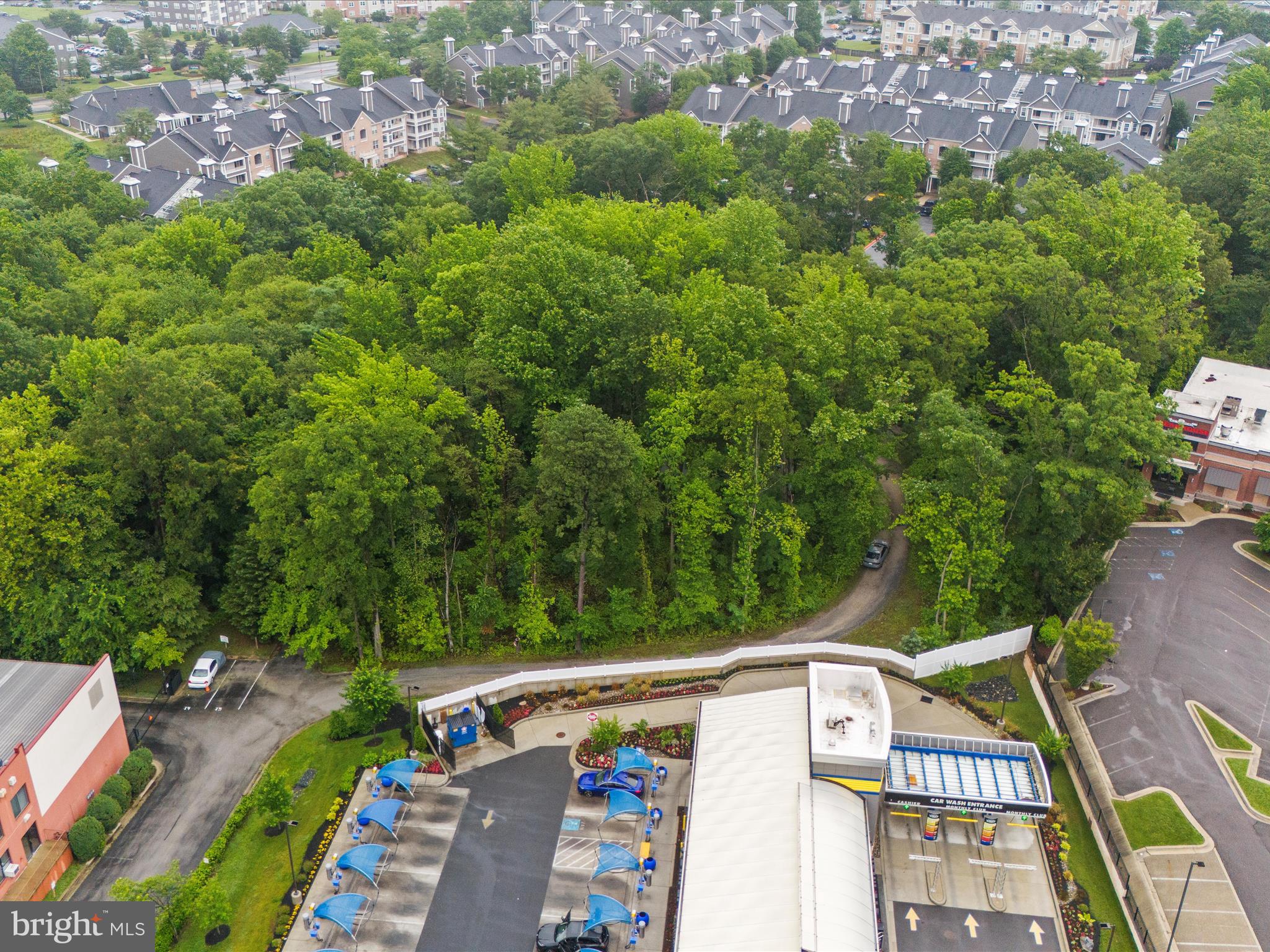 Highly sought-after Mixed-Use Property included in Odenton Town Center Master Plan Section 2. Currently used as a family compound with garage with 1/2 bath. Directly in back of Odenton Self Storage with shared driveway easement. SEE DRONE VIDEO FOR THE PRISTINE PROPERTY