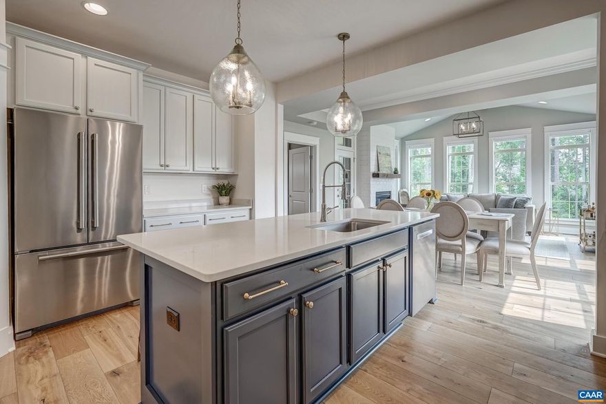 Better than new & without the wait! Luxury appointments throughout this elegant home, built in 2022 by Craig Builders. Owners moving due to job transfer. They spared no detail customizing an exceptional residence, adding extensive upgrades since purchasing. See Special Features for more info! Open flow plan, wide-width oiled hardwoods, two office spaces. Anchoring the center of the home is a dramatic kitchen: quartz counters, 48" induction range & stunning custom hood, flanked by open "British kitchen" shelves. Flow to dining & great room w/ cathedral ceiling, large windows overlooking protected woods. A handsome mantel was created by local artisan! Steps away find a restful owner's suite & luxury bath w/ Carrera marble & towel warmer. Upper level is spacious w/ loft, two bedrooms and bath and ample storage for life's extras. The terrace level is sure to surprise! Large great room opens via barn doors to gym flooded with light. Separate guest quarters are comfortable and access a shady patio. With large stainless steel sink in storage area, create a future kitchenette! All this and in popular Old Trail walking distance to shops & restaurants, direct access to Old Trail & Crozet Trails, an easy drive to wineries and breweries.,Quartz Counter,Fireplace in Great Room