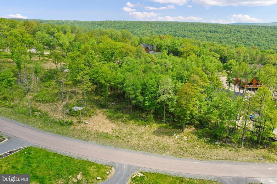 Beautiful 1/2 acre lot in the North Camp Ridge section of the exclusive and gated North Camp Community with spectacular mountain views! Bring your own builder, or use ours! Public water and sewer hookups are available! High-speed internet is available in the community!  Low HOA fee covers common area maintenance, snow removal and road maintenance, and walking trails!  ** Note, this listing is for the lot only.  We have another listing with a potential spec home that could be built.  We've partnered with Dixon Contracting and have many floorplans available for you to choose from!