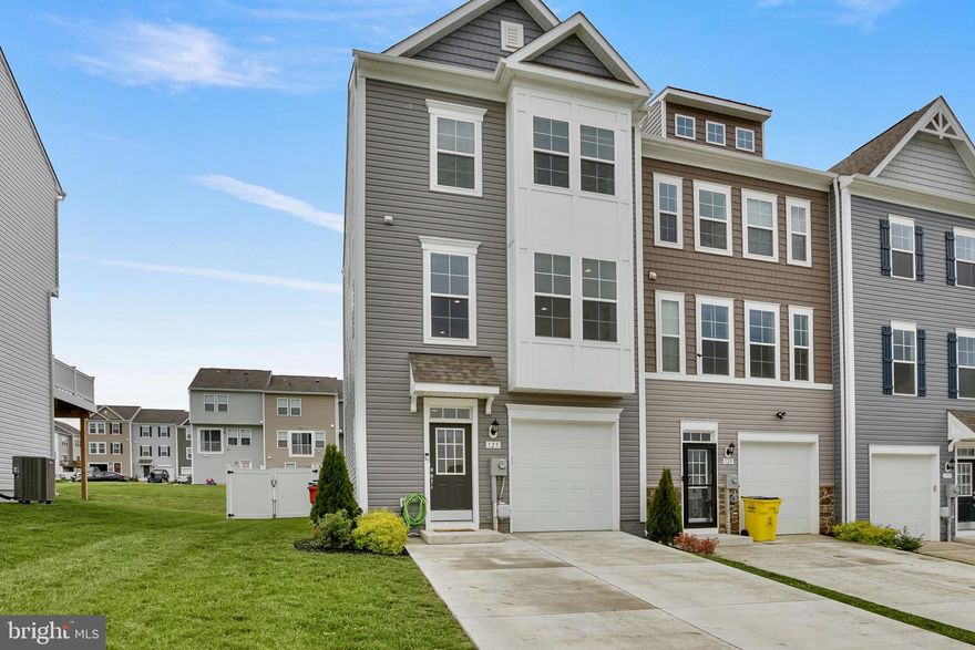 Welcome to 125 Mossdale Boulevard, a spacious and thoughtfully designed 3-bedroom, 3.5-bath townhome located in the desirable Overlook at Riverside community of Falling Waters. Spanning three finished levels, this well-maintained home offers a functional layout and flexible living spaces suited to today’s lifestyle.

The main level (entry level) welcomes you with a large foyer, interior garage access, and a versatile bonus room—perfect for a second living area, home office, or guest space—along with a full bathroom for added convenience. On Upper Level 1, you'll find an open and airy layout featuring a generously sized family room, separate dining area, and a well-appointed kitchen with ample cabinet space. A centrally located half bath adds functionality for everyday living and entertaining.

All three bedrooms are located on Upper Level 2, including a spacious primary suite with a walk-in closet and private en-suite bath. Two additional bedrooms, another full bath, and a dedicated laundry area round out the top floor.

Out back, enjoy a fully fenced yard—ideal for entertaining, gardening, or letting pets play. Situated just minutes from I-81 and Route 11, this home offers easy access to Martinsburg, Hagerstown, and Winchester, and is less than 10 miles from MARC train service to Washington, D.C. Hagerstown Regional Airport is under 30 miles away, and nearby parks, the Potomac River, and the C&O Canal provide endless outdoor recreation.

Move-in ready and ideally located, this townhome is a perfect blend of space, comfort, and convenience in a growing community.