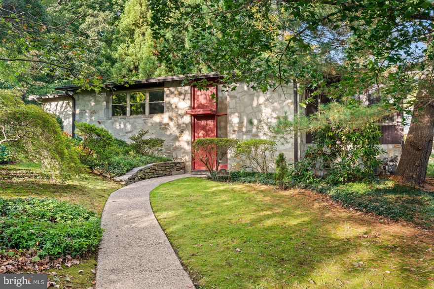 Mid-century modern architecture - this home is a dream and epitomizes mid-century modern design. 101 Elm Avenue presents a rare opportunity to own a mid-century modern home in the heart of Swarthmore. The home was designed in 1950 by Norman N. Rice, a renowned Philadelphia-born architect who contributed to the design of the groundbreaking PFSF Building, and co-taught at Penn with lifelong friend Louis I. Khan. Fortunately, the home has been well preserved and the important elements of mid-century design are present: clean lines, vaulted ceilings, floor-to ceiling windows, open floor plan, functionality, built-ins, and indoor-outdoor living. The house has a concrete and steel I-beam structure which was innovative for its time. Prior owners have preserved the original finishes in the home, including the original St. Charles kitchen cabinets, the preferred choice of iconic architects like Frank Lloyd Wright and Mies van der Rohe, and the original motif and details of the bathrooms. The property has a fabulous hot water radiant floor heat system installed throughout. As you walk up into the main living space of the house you will be immediately greeted by a magnificent stone wall featuring a built-in and a large fireplace, with a stunning vaulted ceiling and a wall of windows with a southeastern exposure. The open floor plan creates a distinct impression and ties together the living room, studio space, and dining room. There are rich hardwood engineered floors throughout the common areas and in the hallway that leads to the bedrooms. The light-filled kitchen maintains its original design with features rooted in functionality, clean lines, and simplicity. A lovely covered side terrace —designed to bring outdoor and indoor spaces together― can be accessed from both the kitchen and the dining room. The outdoor stone wall in the terrace has a built-in grilling station, not currently functioning, as part of the original design. The primary bedroom is spacious, with vaulted ceilings and a line of closets that are roomy and discreet. The en-suite bathroom is ample with an oversized tub and shower combination that still has the vintage Hall-Mack bathroom accessories and Lawson medicine cabinets. The hall bathroom also has period tiles and accessories, and a distinctive walk-in shower. The second bedroom faces southwest and has a row of windows that fills the space with the light of the setting sun. It also benefits from a high, sloping ceiling and a wall of roomy closets and a corner built-in bookcase. The basement provides access to the garage and the utility room. It also has a powder room and a very useful storage room. The laundry is located in the basement. The one car garage is accessed from Swarthmore Avenue and the driveway has a turn around area that doubles as a parking spot. Original blueprints, sketches, documents and photographs have been preserved and come with the house.