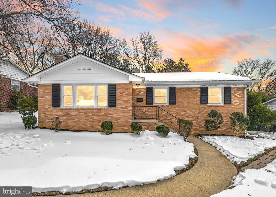 Welcome to this beautifully updated 5-bedroom, 3-bath brick rambler offering over 2,600 sq. ft. plus a screened-in porch in the sought-after College Park Woods community. Step into the spacious, light-filled living room featuring hardwood floors, recessed lighting added in 2025, and a cozy wood-burning fireplace with a brick surround and mantel. The fully remodeled gourmet kitchen (2025) impresses with white soft-close cabinetry, Himalaya Gold quartz countertops, a subway tile backsplash, and all-new stainless steel appliances. An island with bar seating and an adjacent dining area with an updated light fixture create the perfect setting for casual meals or hosting memorable dinner gatherings. For a peaceful retreat, step out to the screened-in porch overlooking the rear yard, an ideal spot to enjoy your morning coffee year-round. When ready to unwind, the main-level owner’s suite features ample closet space and an updated ensuite bath with a tiled walk-in shower (2025). Two additional generously sized bedrooms share a full hallway bath with tub/shower combo, the perfect layout if seeking single-level living. The expansive lower level offers endless possibilities, featuring updated LVP flooring throughout (2023), a large rec room with cozy wood burning fireplace and a kitchenette equipped with ample cabinetry, refrigerator and breakfast area. Two additional spacious bedrooms and a bonus flex room provide flexibility for an in-home office, guest bedroom, gym, or storage room. A full bathroom and convenient laundry room with updated flooring and new utility sink (2026) complete the lower level. Set on a fenced 9,500 sq. ft. lot this property provides an idyllic outdoor space for everyone to enjoy including, gardening, play, or simply unwinding in the fresh air, whether on the screened-in porch or in the yard with tree-lined views. The driveway provides off-street parking for one vehicle, plus plenty of street parking nearby. Recent updates include new windows throughout (2025), roof and gutters (2021), updated patio sliding door and freshly painted patio floors (2026), replaced closet doors in all bedrooms (2025), new front door (2023), and HVAC tuned/recharged in 2022 for added peace of mind. Enjoy easy access to College Park Metro (green and yellow lines), the University of Maryland, and plenty of outdoor options including Paint Branch Trail, College Park Woods Park and College Park Woods Clubhouse. Don’t miss this opportunity!