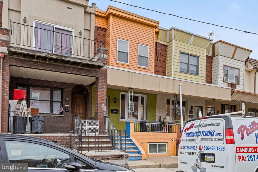 Welcome to 2540 S. 9th Street, nestled in the heart of Philadelphia’s Lower Moyamensing neighborhood. The vibrant exterior colors warmly invite you home, setting the perfect tone for your day. Enjoy your morning coffee on the charming front porch before stepping inside to beautifully preserved original hardwood floors and an abundance of natural sunlight.  The open-concept layout offers a seamless flow from the living room to the dining area and into the eat-in kitchen, where ample counter space makes meal prep and entertaining a breeze.  Step outside to your expansive private yard, perfect for al fresco dining, gardening, barbecues, and more. A coat closet and a convenient powder room complete the first floor.   Upstairs, you'll find four spacious bedrooms, each with ample closet space, along with a hallway bath featuring decorative tile. The unfinished lower level provides endless possibilities with laundry in place and added room whether you need flex space, extra storage, or a customizable bonus area.  Conveniently located just minutes from Passyunk Avenue, Whitman Shopping Plaza, Live Casino, the Stadium District, and major highways, this home offers easy access to Center City, the airport, and public transportation. Plus, ample street parking makes commuting a breeze.  Don’t miss your chance to call this beautiful home yours—schedule your visit today!