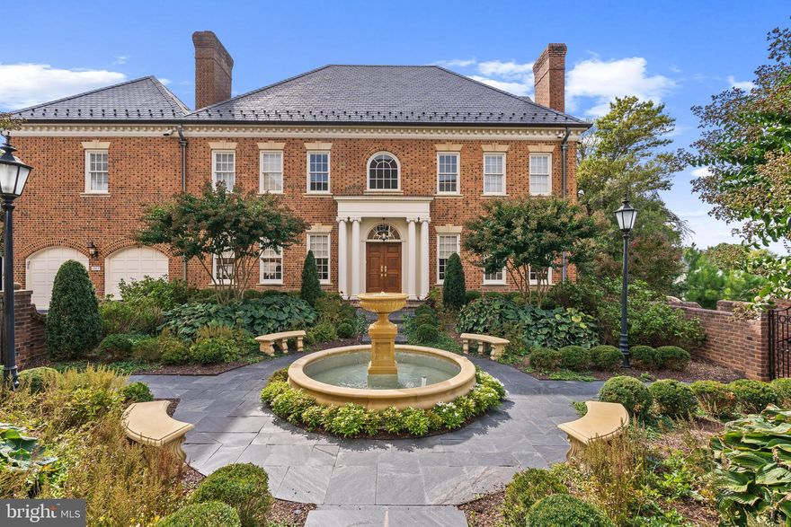Experience the charm and sophistication of London’s finest neighborhoods in the heart of McLean, Virginia, at Merryhill—one of the area’s most prestigious enclaves. This Georgian-style, Flemish bond brick townhome with a slate roof and copper gutters radiates timeless elegance. A serene courtyard with a delightful fountain sets a tranquil tone as you approach this luxurious residence. With windows on three sides, the home is bathed in natural light, highlighting the exquisite millwork that adorns every room.

The gourmet kitchen is a chef’s delight, featuring state-of-the-art appliances, a butler’s pantry, and a cozy breakfast area. Adjoining the kitchen is a warm and inviting family room, complete with custom built-ins and a fireplace. The expansive living room, showcasing large Palladian windows and a fireplace, seamlessly transitions into the formal dining room, where French doors overlook a charming, brick-walled courtyard. 

The journey to the luxurious Primary Suite begins along a hallway lined with built-in bookcases. The suite itself boasts high ceilings, Palladian windows, intricate moldings, and a beautifully appointed primary bathroom and double dressing room closets. The home offers six generously sized bedrooms and six and one half baths, providing ample space for family and guests. An elevator services three levels of the residence.

The lower level is designed for entertaining, featuring high ceilings, a fireplace, full bar, secondary kitchen, large wine cellar, an additional en suite bedroom with an outside entrance, and a spacious media room. Three pairs of French Doors open to the spacious patio, perfect for alfresco gatherings, with a sleek rectangular fire table for enjoying cool evenings.

Ideally situated for the modern commuter, this home offers easy access to Washington, DC, Dulles and Reagan Airports, and the vibrant dining scene in downtown McLean. Just minutes away from world-class shopping and fine dining at Tysons Galleria, this property is also located within the sought-after Langley High School pyramid in Fairfax County.

Merryhill is the epitome of gracious living, combining refined elegance with everyday comfort and low-maintenance luxury. This residence stands as a timeless classic in one of the most desirable locations in the Washington metropolitan area.