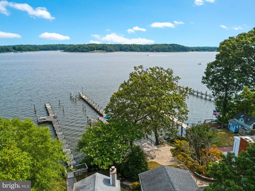 Great opportunity for a 4000+ SF waterfront new construction with expansive views .  Building permit in hand.   This home is to-be-built by Whitehall Building in the sought after community of Loch Haven with panoramic views of the South River.     The existing home will be torn down and the new house will be built.   The property already has a pier with two boat lifts and an electric tram to the pier from the deck.    The cantilevered deck is grandfathered in and provides additional outdoor living space.   The builder is not cutting corners - the base price is inclusive of Hardie Siding, Andersen windows, hardwood floors, ceramic bathrooms, granite countertops, 9' ceiling on the main and upper levels and a fireplace as well as a finished basement.     The open family room, dining area and kitchen all look out to the water.     The kitchen island is the perfect central location of the space and there is a pantry/mud room between the garage and kitchen.   Screened porch on the water side.   The upper level has a laundry room, 3 bedrooms with walk in closets and 3 full bathrooms.   There is a home office on the main level.   The above grade square footage is 3210 and with the basement is 4325.  As far as the views, they are amazing.    This property is located at one of the wider sections of the river the house looks directly over the river to Quiet Waters Park in Annapolis.    It's quick and easy access to the Bay or to waterfront restaurants.     The permits will be applied for once the Buyer (could be you!) decides on their final house design and plans.    You can build this house or any other that will fit into the lot building footprint.     The builder is flexible to work with your design preferences.    Construction-Perm financing or Cash.    $10,000 toward selections/finishes for using the builder's preferred construction-perm lenders and title company.     The builder has already sought out the lenders with the best construction-perm programs.    The photos here were taken at this same house model in a different waterfront location.    Buyers are given an allowance for their own personal selections and finishes.   The community has a beach, marina, boat ramp, sports courts, playground, scenic overlook and an active social committee.Photos are examples of builder's prior work.