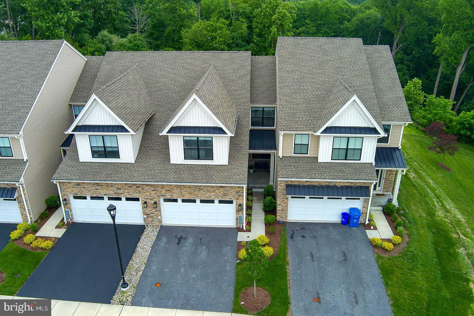 Welcome "home" to 726 Switchman Rd in the incredible community of Franklin Station! This Carriage Collection beauty is nestled on a unique lot location with untouchable green views with a pristine and barely lived in "like new"interior from top to bottom. Enter from the privately situated covered front porch and find an inviting spacious open floor plan with striking beautiful views. This main level offers a seamless flow for daily living or entertaining with an upgraded expansion of the family room and kitchen with perfect access to the rear deck, and has a well appointed dining room. The gourmet kitchen offers gorgeous quartz countertops, custom Century cabinetry, beautiful tiled backsplash, stainless appliances, gas cooking, ample counter space and center island, recessed and pendant lighting, a large pantry, and with seating at both the island and breakfast room. Enjoy additional dining space during three seasons on the trex deck in a gorgeous unobstructed green natural setting. There is a half bath, laundry room, coat closet, and inside access to the 2 car garage on this main level, with striking upgraded hardwood flooring throughout. Upstairs, find a very spacious primary bedroom that exudes both luxury and comfort options, including a generous spa-like bathroom with impeccable details, and a good size primary walk-in closet..with incredible lush green views from here too. .There are two additional spacious bedrooms and a beautiful hall bathroom, with plenty of closets and storage space on this level. Plush upgraded carpeting an added touch of elegance to the 2nd floor. From the foyer, step down to a huge unfinished super clean basement offering 9+ ft ceilings, great finishing potential, storage, and is plumbed for a bathroom/wet bar or other possibilities! The location of this home in the community is unmatched with the amazing green views and its close proximity to the outdoor pool, fitness and community center! Also very convenient to incredible area shopping & restaurant options, walking and biking trails, WaWa train station, Philly airport, Media Boro abundance of everything minutes away, Linvilla Orchards, theater and local events, major roads, and so much more! Rose Tree/Media's award winning schools! This townhome is truly "LIKE NEW" for a turn key move-in day! Furniture is negotiable. List of upgrades available. Square footage of 2200 from builder details with seller upgraded add on to 1st floor. Come see for yourself!