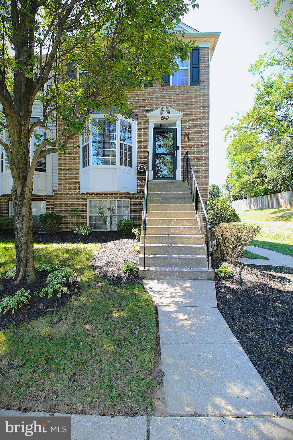 Beautiful, gorgeous & immaculate are the best words to describe this end unit 3 BR & 2 1/2 Bath townhome-condo in Wellfleet Mews- one of the most sought out areas of Crofton, Maryland. When you enter this home, you're met with loads of natural light, thanks to the windows on all three sides. First up is the large eat in kitchen featuring stainless steel appliances, light cabinets and a bay window. You'll feel how large this home is when you enter the open living room/dining room combination. Highlights include the gas fireplace, custom lighting and the glass slider leading to the rear deck. Imagine yourself entertaining company or having a cup of coffee out there. This floor is rounded out with a custom powder room that rivals something you'd see in a model. As you head upstairs, you'd be right to get excited about the sumptuous primary suite, including the primary bath and walk-in closet. There are two other bedrooms and a bathroom to complete this level. This unit has been well maintained and is a must see! The list of improvements includes a NEW HVAC & NEW water heater, NEW washer & dryer, NEW Refrigerator, NEW front & basement storm doors & sliding deck door, and NEW LVP flooring & carpet. There's also fresh paint and the deck has been power washed and stained. This home is zoned for the highly desirable Crofton Middle and Crofton High Schools. You can move in with peace of mind. Wellfleet Mews offers a pool, tennis courts, a playground and trails. You have quick access to restaurants, a movie theater, grocery stores and other shopping. Everything you've been waiting for can be found at 2441 Lizbec Court. Come and buy it today.