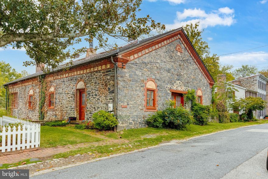 RARELY AVAILABLE! BEAUTIFUL, HISTORIC 5BR/3FB Stone House with over 5,000 sqft of living space with 25+ ft ceilings! Absolutely Unique House with stunning artwork and sculptures throughout! An art Studio and home for a local Sculptor in the Dickeyville Historic District. Living space and tenant's loft are on separate wings of this building. Sculptures do not convey, building requires some updates and sold 'as is'. Fantastic view overlooking Leakin Park and Gwynns Falls. There is no other property like this in the entire Baltimore Area - come check out this unique property today!  This is a dream home waiting to happen!