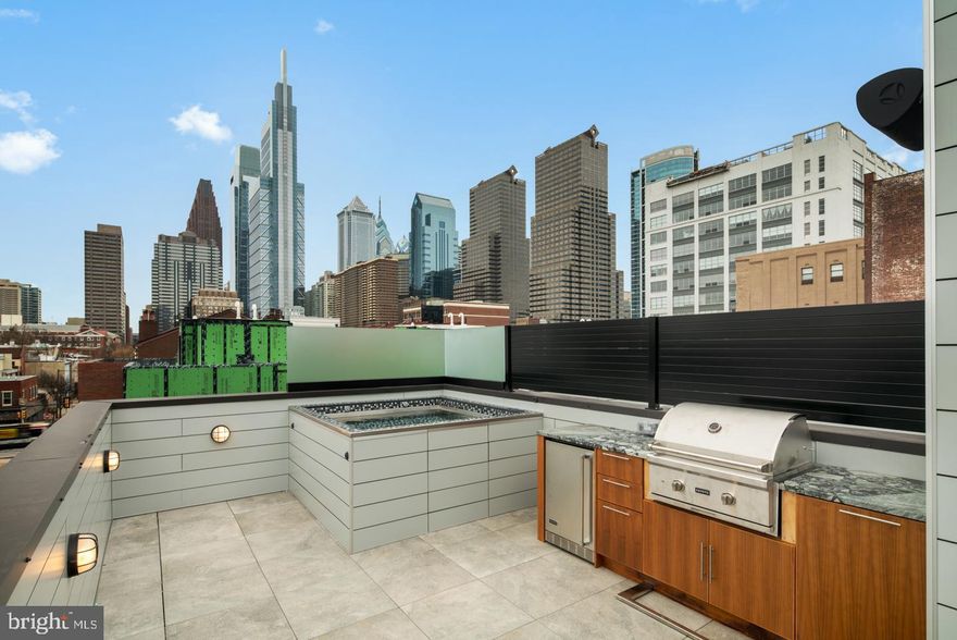 Fully Loaded home in the coveted Logan 23 development located in the Albert M. Greenfield School catchment in the 19103 zip code. 127 N. 23rd St, comes with a rooftop plunge pool and rooftop kitchen, a fireplace in the living room and several other upgrades. Logan 23 homes are Sensational new 4-story homes with 3-CAR GARAGES, GATED driveway, Tax abatement, 5-stop elevators, Smart-home systems (control 4), Roof-deck, three outdoor areas per home, and skyline views. FULL 10 year Tax Abatement approved!! Remember, at the end of 2020 the FULL tax abatement goes away!! This may be the last opportunity to purchase a home in 19103 with a FULL 10 year abatement. do not procrastinate!! Logan 23 has the exact amenities everyone has been looking for. 8 homes located on quaint Croskey Street and 8 homes on 23rd Street starting at the corner of Cherry Street. This amazing development has a gated driveway and luxury finishes throughout. The kitchen comes with luxury panel ready appliances, Quartz counters with 2 cm eased edges and a ton of high-end cabinets. There is a large deck off the living room, perfect for entertaining and the BBQ. All of the bathrooms have designer vanities, amazing large format tile selections, and custom fixtures with super cool mirrors and lighting choices. The full floor master suite is to die for and includes walk in closets with custom shelving systems, a five piece bathroom with free standing oval tub, huge walk in shower with glass doors, body sprays and his and her hand held shower fixtures. The elevator takes you all the way to the jaw dropping roof deck, which has stunning views. There are no other homes on the market like LOGAN 23. Fantastic location steps away from the new FITLER CLUB, Philly's only lifestyle club with world-class restaurants & bars, a Field House, study and event spaces. Also steps above Rittenhouse and a half block from the Schuylkill river trail!! More amazing features of the LOGAN 23 homes include, full size laundry rooms with W/D included, designer staircases with metal handrails, multi zone heating and air systems, alarm systems, fireplace and motorized shades options, Kohler plumbing fixtures, LED recessed lights, gated driveway, and again, 3-CAR GARAGES! Construction is 98% complete, as the photos reflect. The Croskey Street homes are identical to the 23rd street homes. There are only two corner homes available! All square footage numbers are approximate and include above and below grade square footage. Square footage should be verified by the buyer. It is the responsibility of the buyer to verify real estate taxes. Taxes and condo fees are estimated.