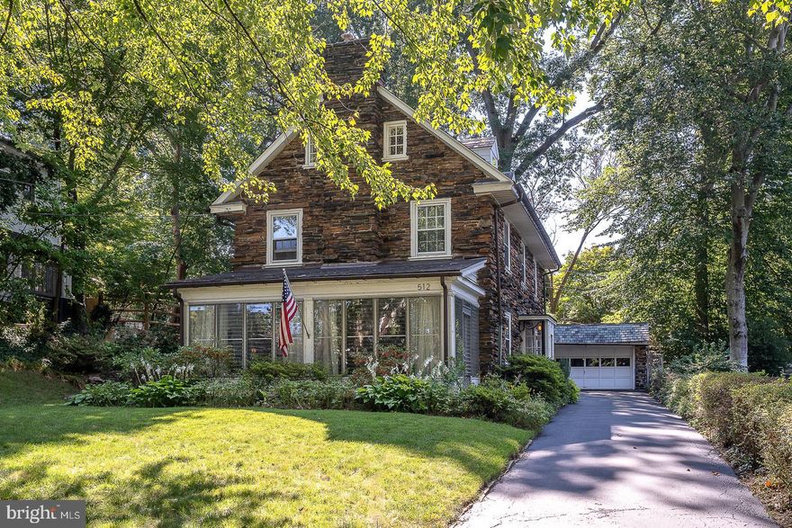Classic Stone Colonial on Sought-After Street
Welcome to 512 Anthwyn Road, a beautifully maintained classic stone Colonial home located in the heart of Merion Station, PA. This charming residence offers an exquisite blend of timeless elegance and modern conveniences across its almost 2500 square feet of living space.
As you approach, the unique stone exterior and slate roof immediately capture your attention, radiating a sense of durability and classic style. Enter through an enclosed vestibule into a lovely center hall, where you'll find deep window sills and gleaming hardwood floors that set a welcoming tone.
The spacious living room, featuring a wood-burning fireplace, provides a cozy yet grand space perfect for relaxation or entertaining. A door leads out to a bright enclosed porch with flagstone flooring, a stone wall, and three walls of windows, creating an inviting space to enjoy the outdoors in comfort.
Adjacent to the living room, the formal dining room offers an elegant setting for meals and gatherings. Beyond the dining room, a functional kitchen awaits, complete with an adjoining mudroom and a walk-in pantry, ensuring ample storage and convenience.
Ascend the gracious staircase, accented by an arched window, to the second floor. The primary bedroom is a serene retreat, featuring a walk-in closet and a full bath with a stall shower. Two additional well-sized bedrooms share an updated hall bath with ceramic tile, providing comfort and privacy.
The open staircase continues to the finished third floor, where you'll find two more bedrooms and an additional full bath, perfect for guests or flexible living arrangements.
The unfinished basement includes a laundry area and a large room with wood flooring, offering potential for additional living space or storage. Mature plantings surround the home, enhancing its curb appeal and providing a tranquil setting.
Completing this remarkable property is a detached two-car garage with stairs leading up to a private fenced-in yard area, ideal for outdoor activities and relaxation.
This home is in wonderful condition and enjoys a terrific location, with the added bonus of being able to walk to downtown Narberth. Experience the perfect blend of classic charm and modern living at 512 Anthwyn Road. Don't miss the opportunity to make this exceptional property your new home!