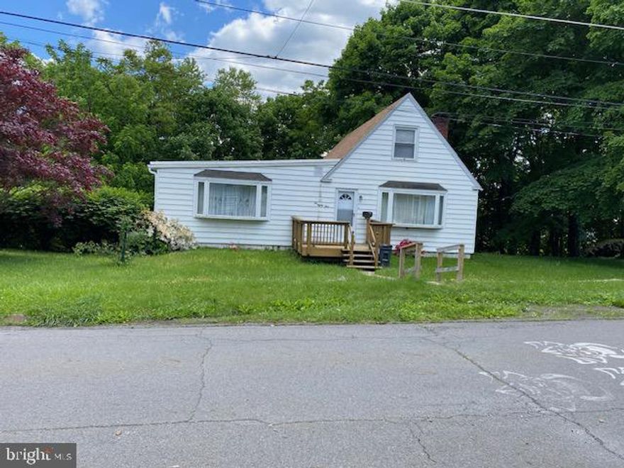 Shenandoah Heights has a NEW listing offered for the first time - 3 lots are combined to offer privacy.  America's favorite home - a Cape Cod with 3 bedrooms, 1 bath on main level with a facility in the lower level.  UNIQUE feature 0 how about a Wood Burning Pizza Oven next to the brick fireplace.  There is a newer oil furnace & replacement windows.  Convenient walk out basement thru 2 car built-in garage.  Off street parking behind garage.