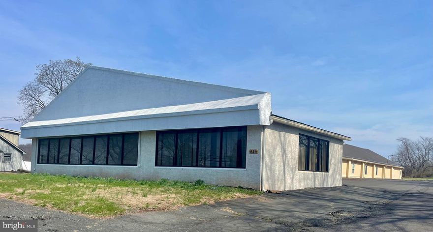 NOW SHOWING - expansive 8,000+ square foot commercial building situated on over 3 acres offering great opportunity for your business with high visibility & exceptional versatility!  Previously utilized as an auto dealership and antique shop, and currently operating as a church, this property is well-suited for a wide range of business uses.  The interior features large meeting rooms, conference spaces, a welcoming main foyer, full kitchen, and a spacious dining hall. The layout can easily be adapted for a conference center, event venue, showroom, or other commercial ventures. Additional highlights include zoned HVAC, updated modern roof, ample storage throughout, and parking for over 50++ vehicles. The property provides an ideal location just north of major intersections for Walmart & Blommer Chocolate Company plus convenient access to major routes, making it ideal for businesses seeking high accessibility and exposure.  With additional land on the side and rear for potential expansion or development, this property presents endless possibilities. Bring your business vision—this is a rare opportunity with incredible potential.Schedule your visit today!