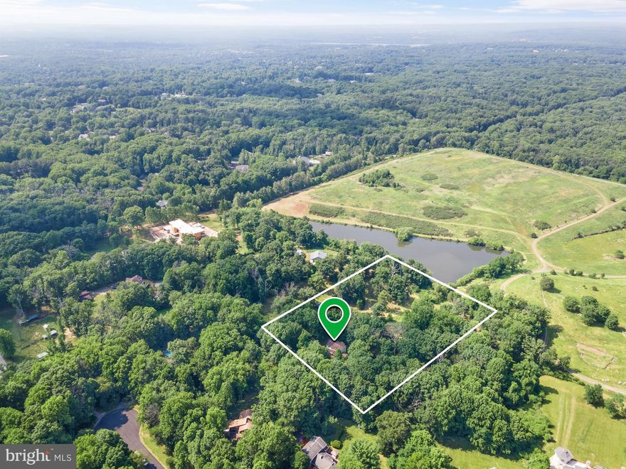 Premiere 8.71 Acre Lot! Build your own custom dream home. This lot supports $5M+ homes. Picture yourself driving down your private driveway as it opens up to 8.71 acres of trees and pastures. Relax and listen to nature. Plenty of land for horses to roam or keep as open undisturbed land. There is currently an as-is home on the property that has 4 bedrooms, 3.5 baths, and 3,091 finished square feet. You can make it your own or take down and build your own custom estate. There is well water, septic sewer, and natural gas is connected.  Amazing Great Falls location close to all that D.C, Maryland, and Northern Virginia have to offer. This is your chance to customize your own private retreat.
