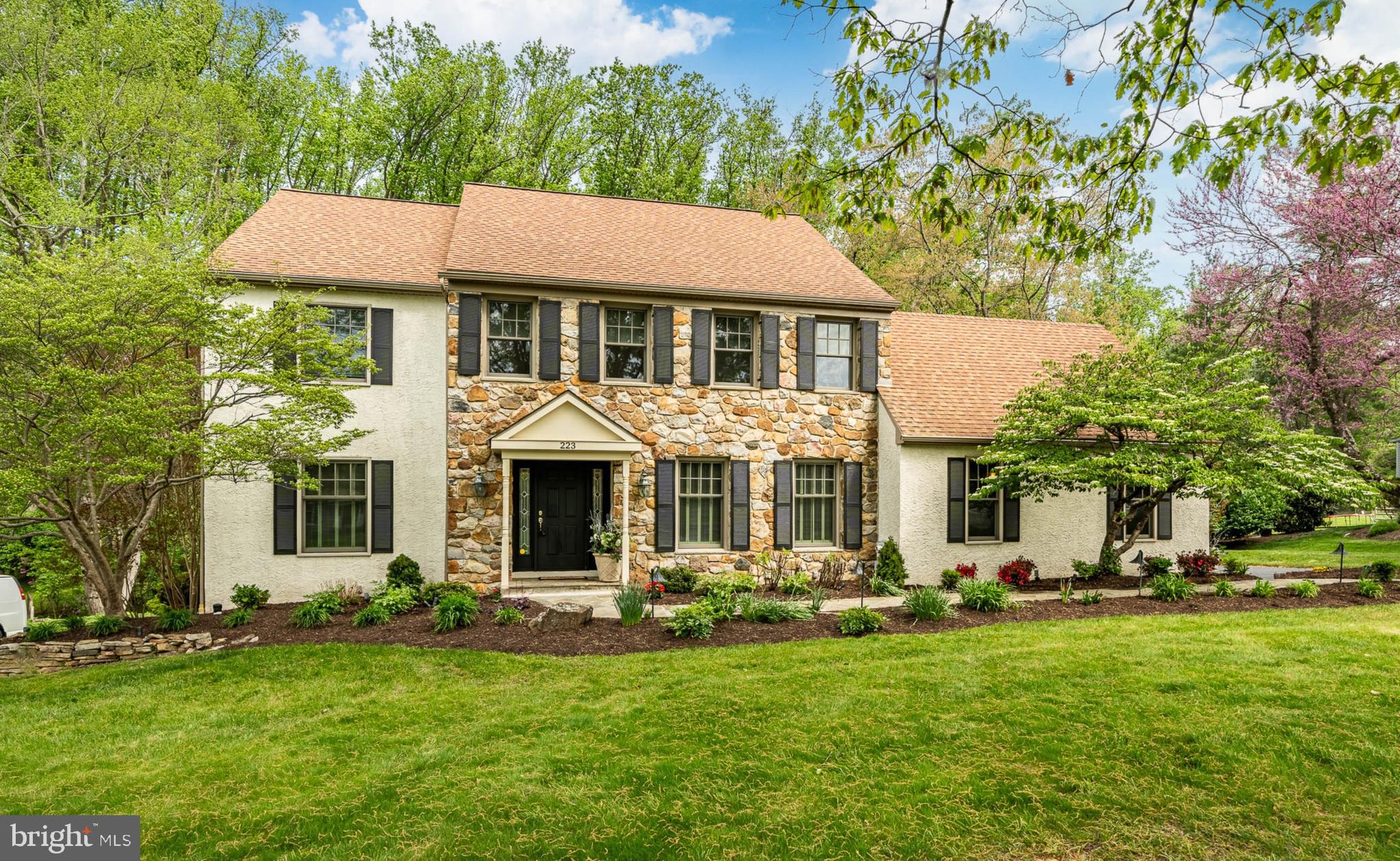 Welcome to 223 Cheshire Circle, an exquisite colonial residence nestled in the
charming and serene community of White Chimneys in West Chester.
Enjoy a private setting with no rear neighbors due to the adjacent preserved land, your bucolic views will never change!
This elegant home spans approximately 4000 square feet of thoughtfully designed living space,
situated on an expansive 25,000-square-foot lot that offers ample privacy and tranquility.
As you step inside, you will find a cozy living room—perfect for relaxing evenings, you will find the attached oversized formal dining room adorned by a large bumped out bay window, making it light and bright-- a great spot for family gatherings. This kitchen is a Cook's dream, located in the heart of the home featuring sleek granite countertops, upgraded appliances, large island, eat-in-kitchen, and plenty of storage, including a spacious pantry. The oversized family room has a cozy gas fireplace, vaulted ceilings, two skylights, ceiling fan, and French doors leading to the added on enclosed three season sunroom. Exiting from the kitchen or sunroom, you will find double, slated patios, a Sunsetter awning, and a garden oasis. The outdoor BBQ area offers a seamless extension of your living space- perfect for weekend grilling or sunset dinners. The primary en-suite is a true retreat, the amenities include an oversized, bedroom flooded with light, large dressing area with countertops and sink, walk in closet and an additional closet for optimal storage. The bathroom is complete with a luxurious Jacuzzi tub, vanity, shower and two beautiful hand painted Murals.
This home features an additional three generous size bedrooms oversized from the original floor plan, each offering ample space and comfort. There is a whole house fan controlled on the second floor as well as two additional rooms off the fourth bedroom, one is a walk in closet; the other is a large cedar closet, and please don’t forget the second floor walk-in laundry room. All of this additional space was added on as extra living space by the current owners. Explore the fully finished large lower level which is perfect for storage, at home gym and entertaining. There is a private enclosed room- currently used as a wine cellar, featuring an original hand-painted mural titled “Scenes of Italy.” Also, located in the lower level is the utility room with two large walls with built-in shelving. 223 Cheshire Circle also has a security system, and an exterior French drain that surrounds the home—completely dry basement. This home has been lovingly, maintained with newer windows, roof, HVAC system, plus a whole house generator, and a brand-new hot water heater, If you're looking for a home that is move in ready, combining style and comfort effortlessly…
223 Cheshire Circle is ready to welcome you home!