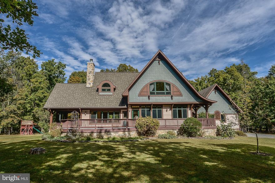 Custom Craftsman featured on the cover of Better Homes & Gardens! 5 car garage! Out-building w/ office or apt. Exquisite features & accouterments, array of windows & natural light! Open Kitchen w/center Isle. Top line appliances, Solid maple cabinets in kitchen & thru out. Extensive cabinet work in all 4 bath rooms.,10 private acres.