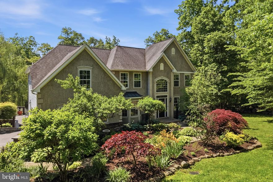 This Neo-colonial home is nestled on 5.75 partially wooded acres. It balances timeless, symmetrical architectural styling with modern spacious living in a private park-like setting. It offers the stately curb appeal of a colonial estate with abundant distance between neighbors but close to everything you need.
As you wind down the long-paved driveway you will immediately be impressed with its great curb appeal enhanced by the well planned and maintained landscaping featuring  many perennial plantings and specimen trees. A paver walkway leads to the impressive central entrance door.
This center hall plan opens into a dramatic two-story foyer with sparkling hardwood floors and overlooking balcony. Directly to the right is a large formal living room/den. It also boasts of hardwood floors. To the left of the foyer is an elegant formal dining room. It's the ideal place for your family holiday meals. The central focus of the first floor is the large eat in kitchen and adjoining two story family room.
Just imagine hosting parties here or just enjoying time with the family. The kitchen has ample oak cabinets, hard surface counter tops, stainless steel appliances, pantry and a bright and cheery breakfast nook. 
Relax in the adjoining two-story family room and watch a movie or your favorite team play a game. It has a warm and inviting fireplace for those cold winter nights. Also, for those who work from home there is a cozy den/office/library located on the first floor. 
Additionally, there is a very convenient first floor bath with a shower. 
You will fall in love with the expansive rear deck that you gain access to off the kitchen. It has been replaced with composite deck material for ease of maintenance and can host a large family gathering for those special occasions. It directly overlooks the private rear yard. The owner has added an awning for those hot summer days.
Adjourn to the second floor to the large master bedroom suite. It features a volume ceiling, luxurious master bath and a very convenient walk-in closet and a large multipurpose sitting room / exercise room. 
Additionally, there are three bedrooms all of ample size and a full hall bath with a tub/shower.  The very well-designed balcony overlooks the family room and two-story foyer.
The full basement has been partially finished providing a great rainy day play area for the kids. Also, the unfinished portion is ideal for storage or a workshop or hobby area.
Attached to the home is an oversized two car garage. The floor has been painted with epoxy resin paint for a sharp clean look and ease of maintenance.
The private rear yard is partially wooded and boasts of an established fenced vegetable garden. It’s ready for your plantings as we speak.
A very impressive addition to the home is the custom built two car detached garage. It will provide a perfect place for your hobby cars and yard tools. The second floor is finished into a large workshop.
Oh, and don't miss the koi pond as you walk between the house and garage. It adds a very soothing effect to the home and features aquatic plantings as well as a few fish.
This private hideaway is just minutes to the quaint Skippack Village, Spring Mount ski area, the Perkiomen trail system, Philadelphia Premium Outlets and major highways like Route 422 the Pa. turnpike and Route 476.
Hurry out and make this home yours. It awaits your personal touches.