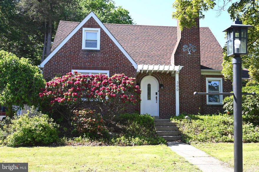 This is a Unique Cottage Style Home with Private Drive and 2 Car Attached Garage situated on a deep 90 x 240 level lot.  Curb appeal abounds the surroundings from Multiple Pergola Covered Entryways to Views of Mature Shrubs and Garden Beds.  Inside finds warm Hardwoods, Custom Woodworking and Finishes throughout the Home.  The original Grand Fireplace (upgraded to Natural Gas) will catch your eye as you enter a quite generously sized Living Room.  This room also features a side door for you to Enjoy cool nights and hot summer days on the Covered Porch.  To the left of the Entry Foyer is a large Formal Dining Room with Plenty of Space to gather round with extra guests and host those special occasions!  The Custom Kitchen is very Pub-like and provides an Abundance of Specialty Cabinets & Appliances as well as a Wraparound Bar.  The rest of the Kitchen space is wide open with Extra Room for table, chairs and other furnishings, Flat Screen TV or other electronic devices! A Powder Room, Interior Access to Attached Garage and True Airlight French Doors to Driveway & Covered Porch are Additional Features in this Pub-like Space. Upstairs finds Master Bedroom with very Large and Lighted Walk In Closet,  a Hall Bath, 2 Additional Bedrooms and Extra Storage Closets. The Basement is dry with concealed French Drain and sump pump.  Laundry and utility area has been well cared for with Gas Heat, Central Air and Mechanical Systems continuously maintained and serviced. Clean walls and painted floor offer a nice semi finished space for Extra Storage, Recreation and Opportunity for creating additional living space of your Own Design.  Beautiful Home on Large Corner Lot in the Heart of Springfield Township.  Walk to Schools, Parks, Fields, Shopping, Dining!  Come See, You'll LOVE IT!!!