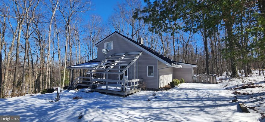 3BR, 2BA turnkey vacation retreat! Upgrades GALORE! This home been tastefully remodeled updated bathrooms, flooring, kitchen, EV charger and offered fully furnished! One top of that, new in 2024: 40 year metal/steel roof with sky lights, egress windows replaced in each bedroom, Mesh Wireless Network added (including wifi extenders), smartlocks, washing machine, refrigerator, dishwasher and fully permitted for short term vacation rentals! Highly sought after neighborhood in the southern hills of Deep Creek Lake, you will love the privacy of Pergin Farm!  Massive mature trees, outdoor firepit, partially fenced yard and extended driveway with plenty of parking for cars & boat/trailer. Owners are currently renting the home privately on Airbnb, "Woodland Sage". Amazing attention to detail and a unique floor plan; this property really has it all. Limited availability around vacation rentals, call to schedule a private showing!